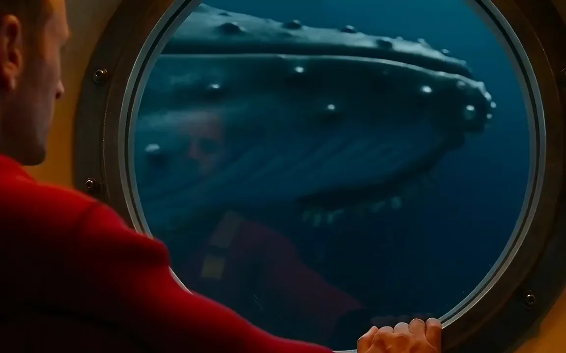AI video generator clip of a crew member watching a whale glide past a submarine porthole