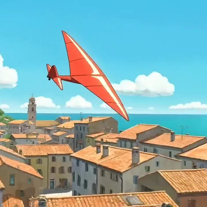 Clip aus dem KI-Video-Generator mit einem roten Segelflugzeug im Anime-Stil, das sich über einer Küstenstadt in die Kurve legt