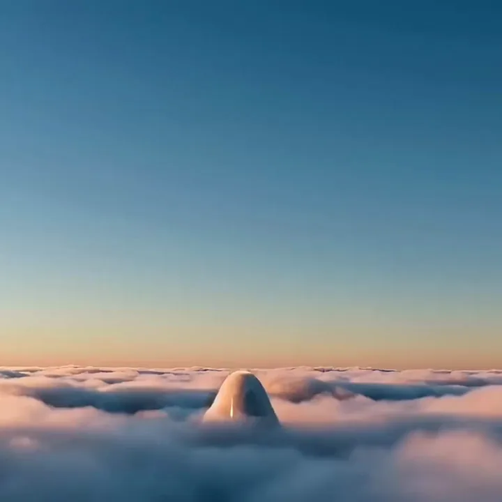 Silver capsule climbing a thin cable out of a sea of clouds into a clear blue sky