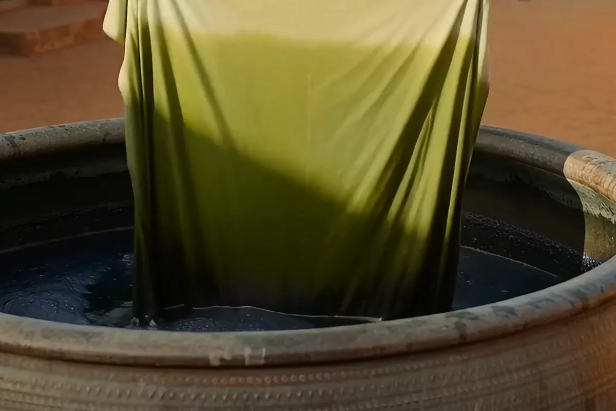FLUX 3 video of a cloth held over an indigo vat turning from yellow green to deep blue