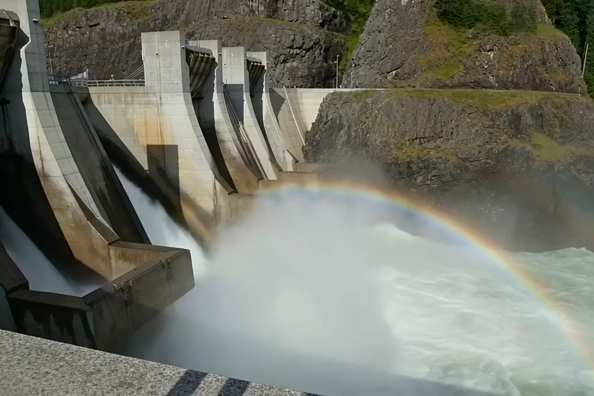 Gemini Omni video of dam gates releasing white water into a gorge in an arc of mist with a rainbow