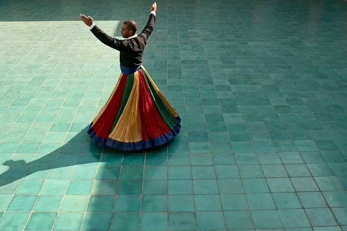 Runway Gen-4 Turbo video of a tanoura dancer spinning his striped skirt into a wide disc