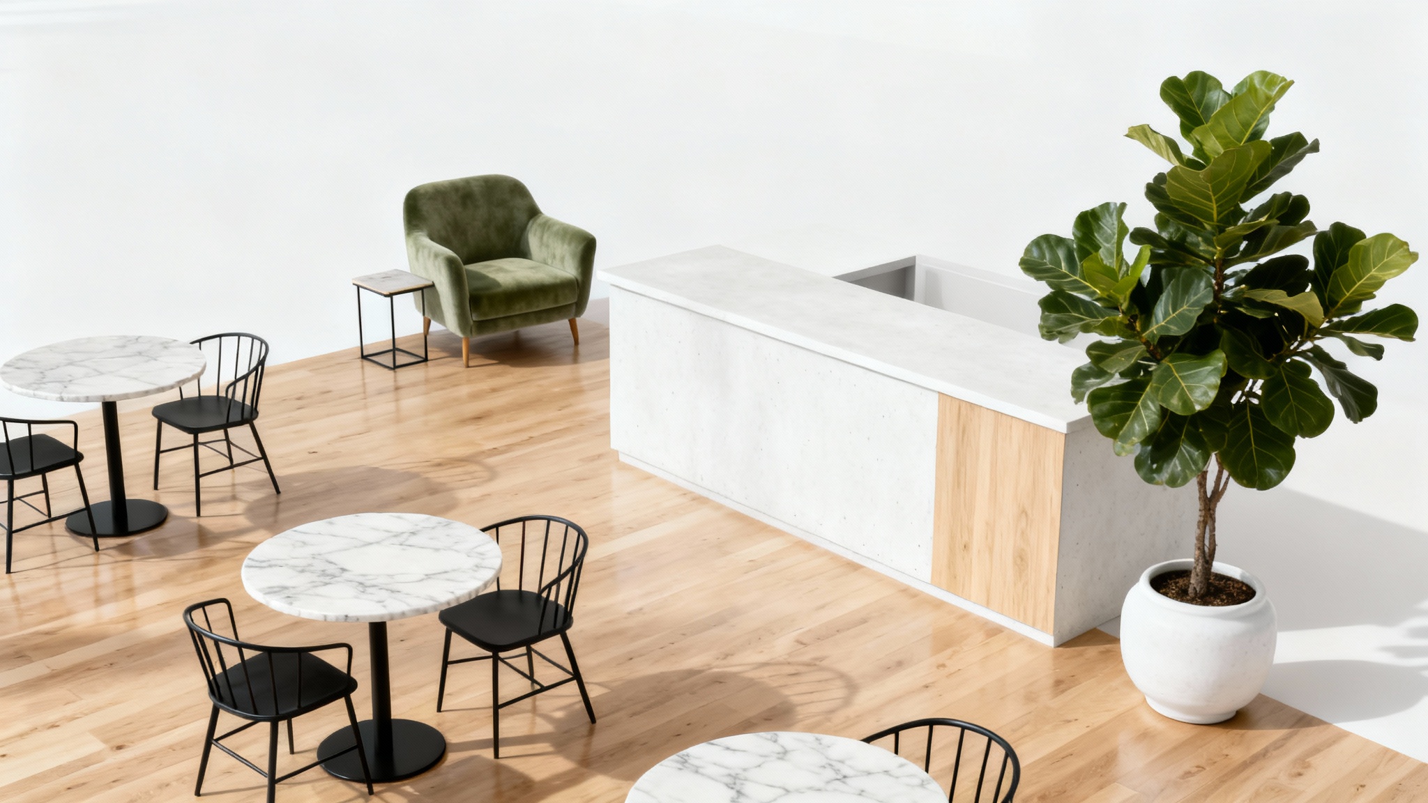 A stylish and modern cafe interior mockup featuring marble tables, minimalist chairs, a green velvet armchair, and a large plant, all set against a clean white background.