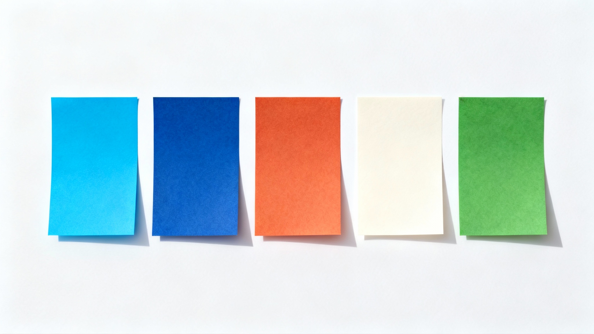 A top-down view of five rectangular color swatches arranged in a row on a white background, representing the 'Bluey' color palette with shades of blue, orange, cream, and green.