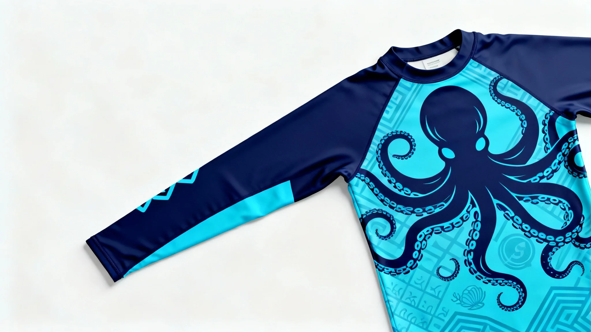 A top-down view of a long-sleeve rash guard with a detailed blue octopus design, laid flat on a white background in a product mockup style.