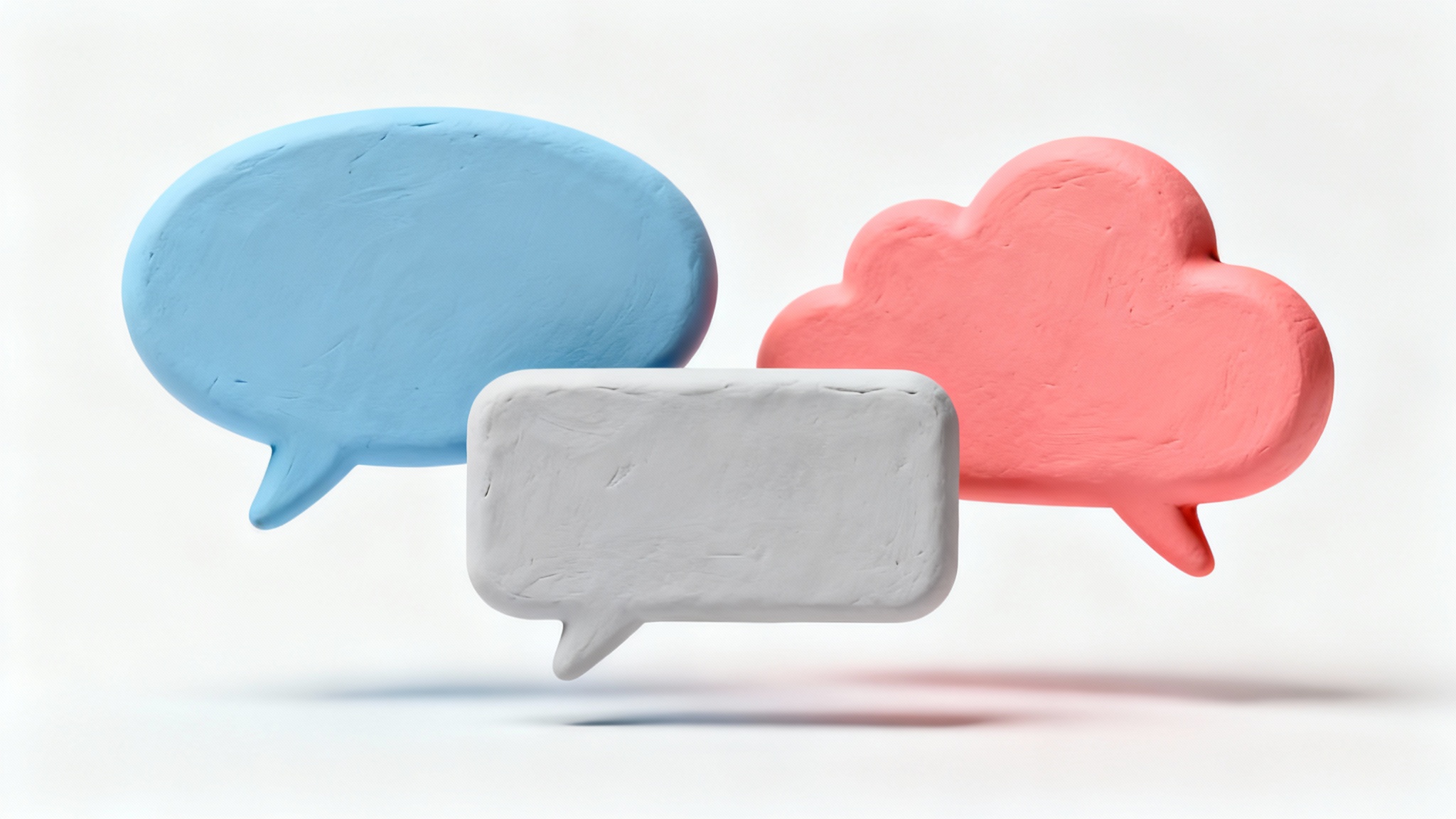 A collection of 3D-rendered speech bubbles in pastel blue, gray, and coral pink, floating in various shapes against a clean white background.
