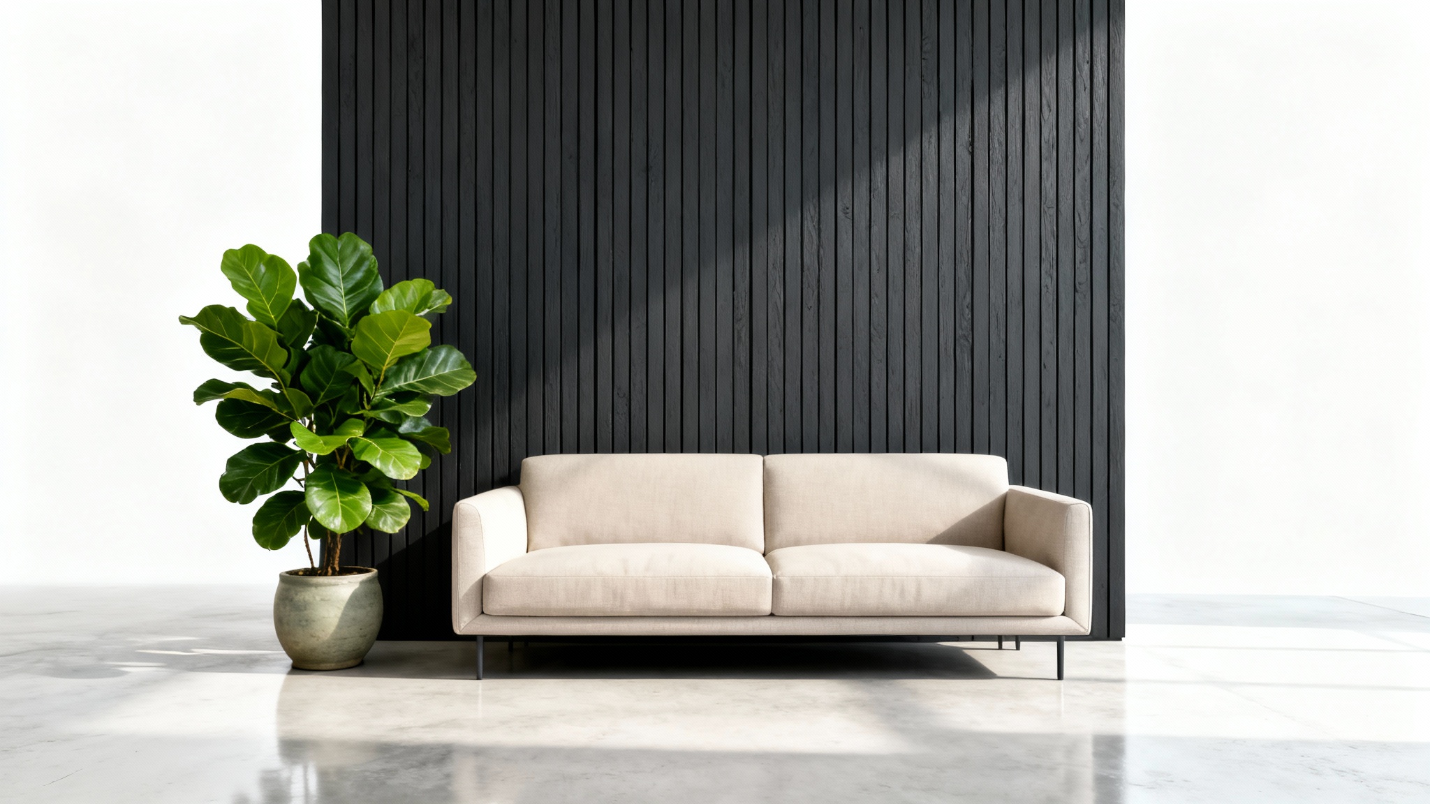 A mockup of a modern living room showcasing a dark, textured accent wall behind a minimalist beige sofa, isolated against a white background.