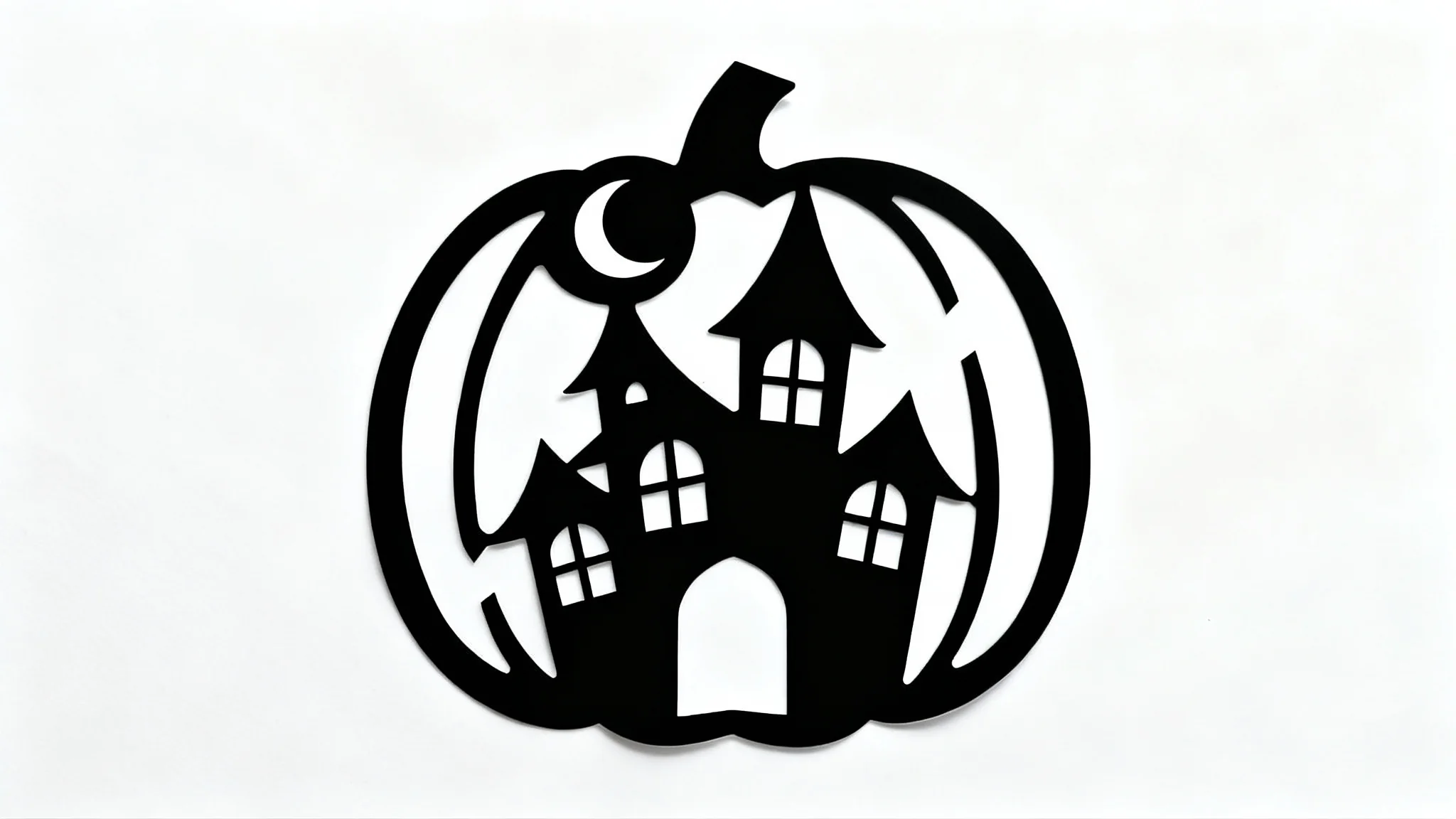 A black and white stencil for pumpkin carving, featuring a spooky haunted house design, laid flat on a white background.