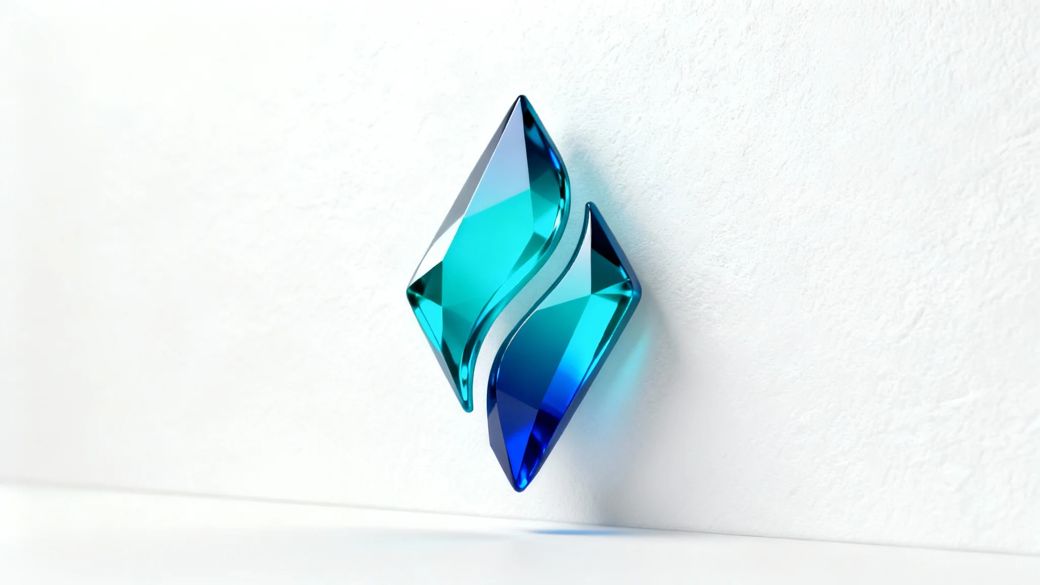 A photorealistic mockup of a modern 3D blue logo, presented against a clean white background. The logo is an abstract, geometric crystal shape with a glossy finish, colored in shades of sapphire and cyan blue. It is mounted on a white wall, creating a professional and minimalist aesthetic.