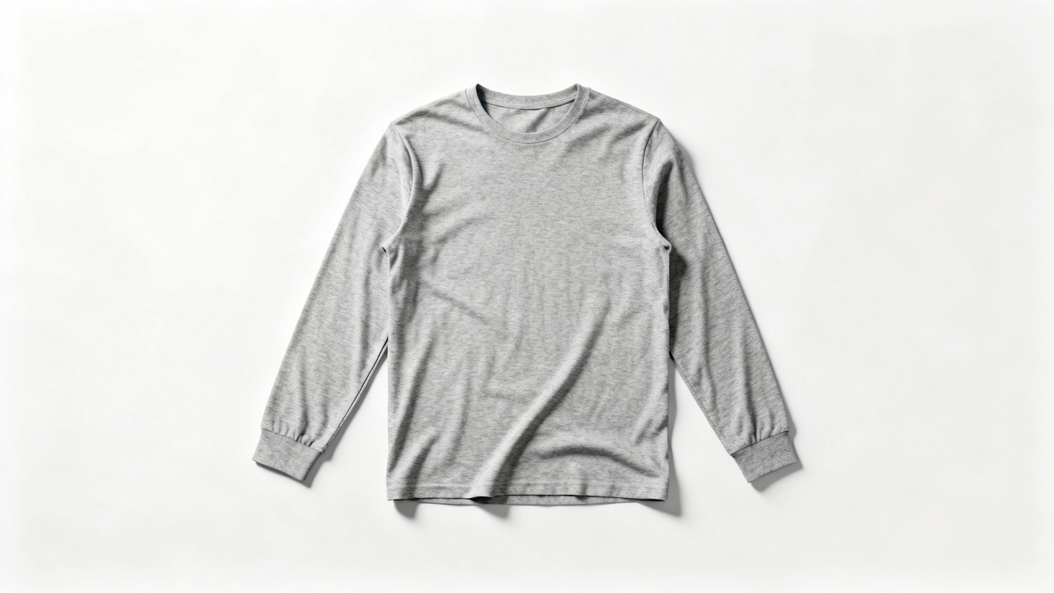 A photorealistic mockup of a blank heather grey long-sleeve shirt laid flat against a solid white background, ready for a custom design.
