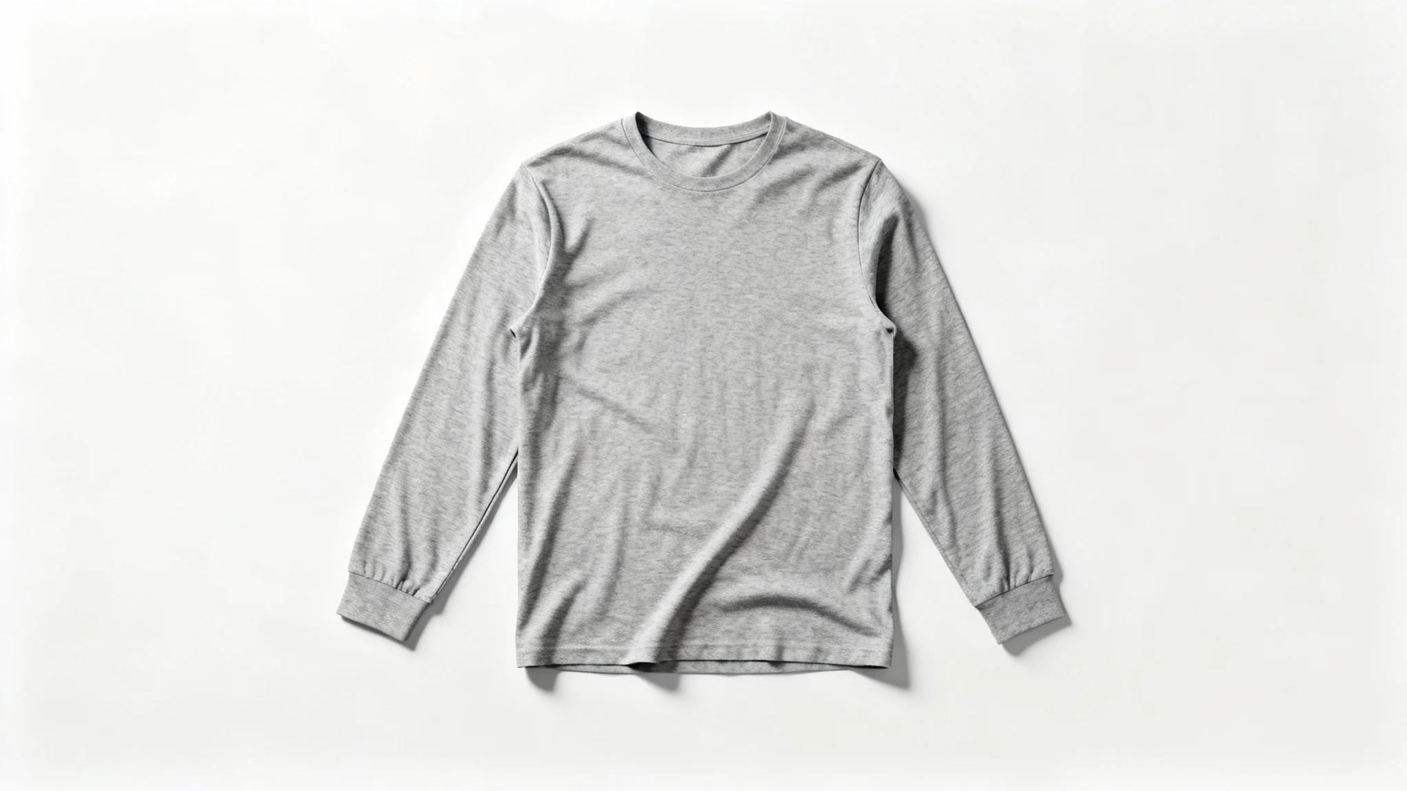 A photorealistic mockup of a blank heather grey long-sleeve shirt laid flat against a solid white background, ready for a custom design.