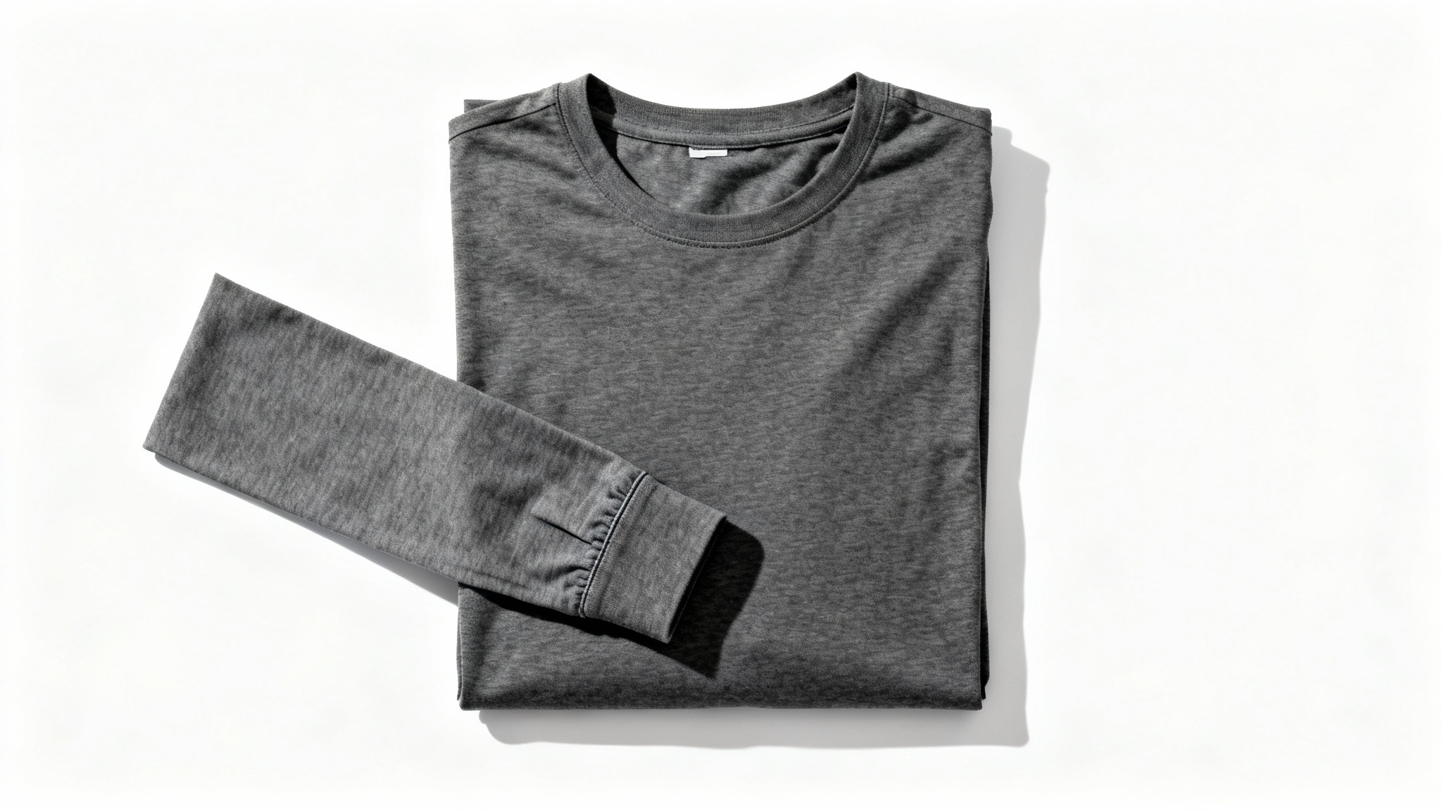 A flat lay product mockup of a charcoal grey long-sleeve shirt neatly arranged on a solid white background.