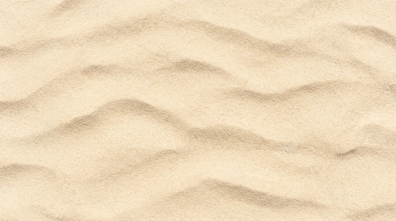 A close-up, top-down view of a seamless, tileable texture of fine, light-colored sand with soft ripples.