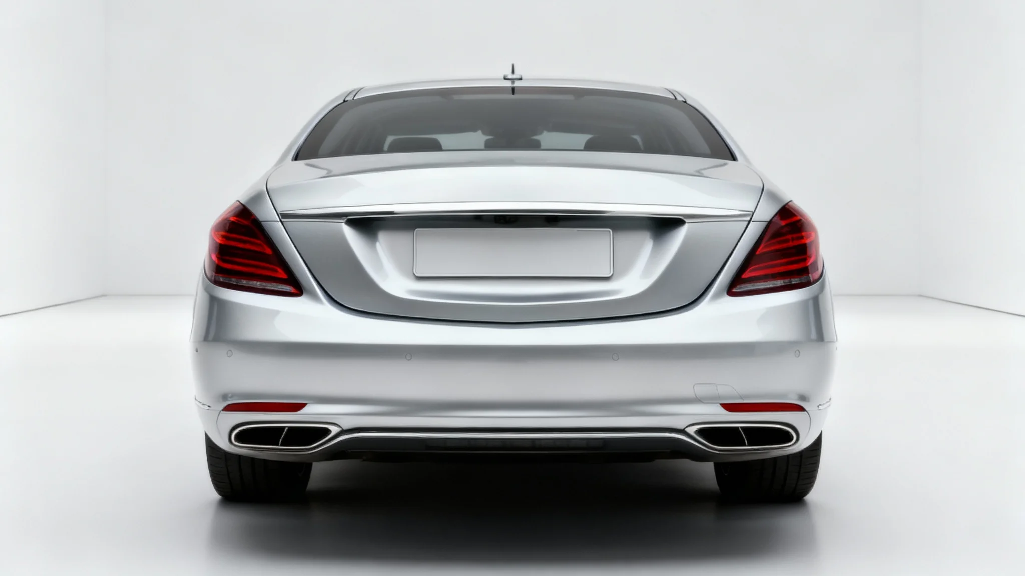 A photorealistic image of the back of a silver car with a clean, empty space where the license plate would normally be, set against a plain white background.
