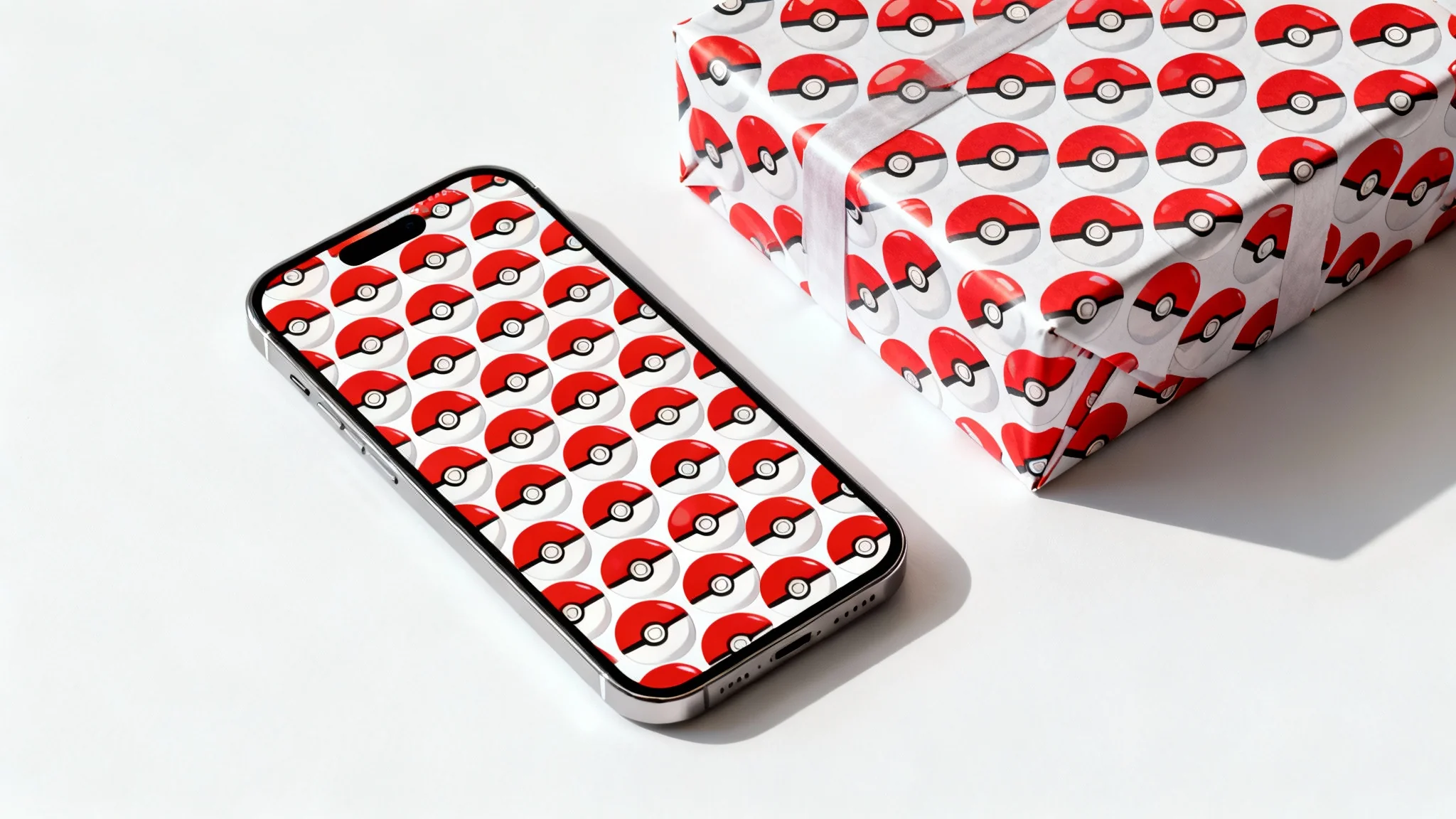 A professional product mockup showing a smartphone and a gift box, both decorated with a repeating red and white Pokeball pattern, on a clean white background.