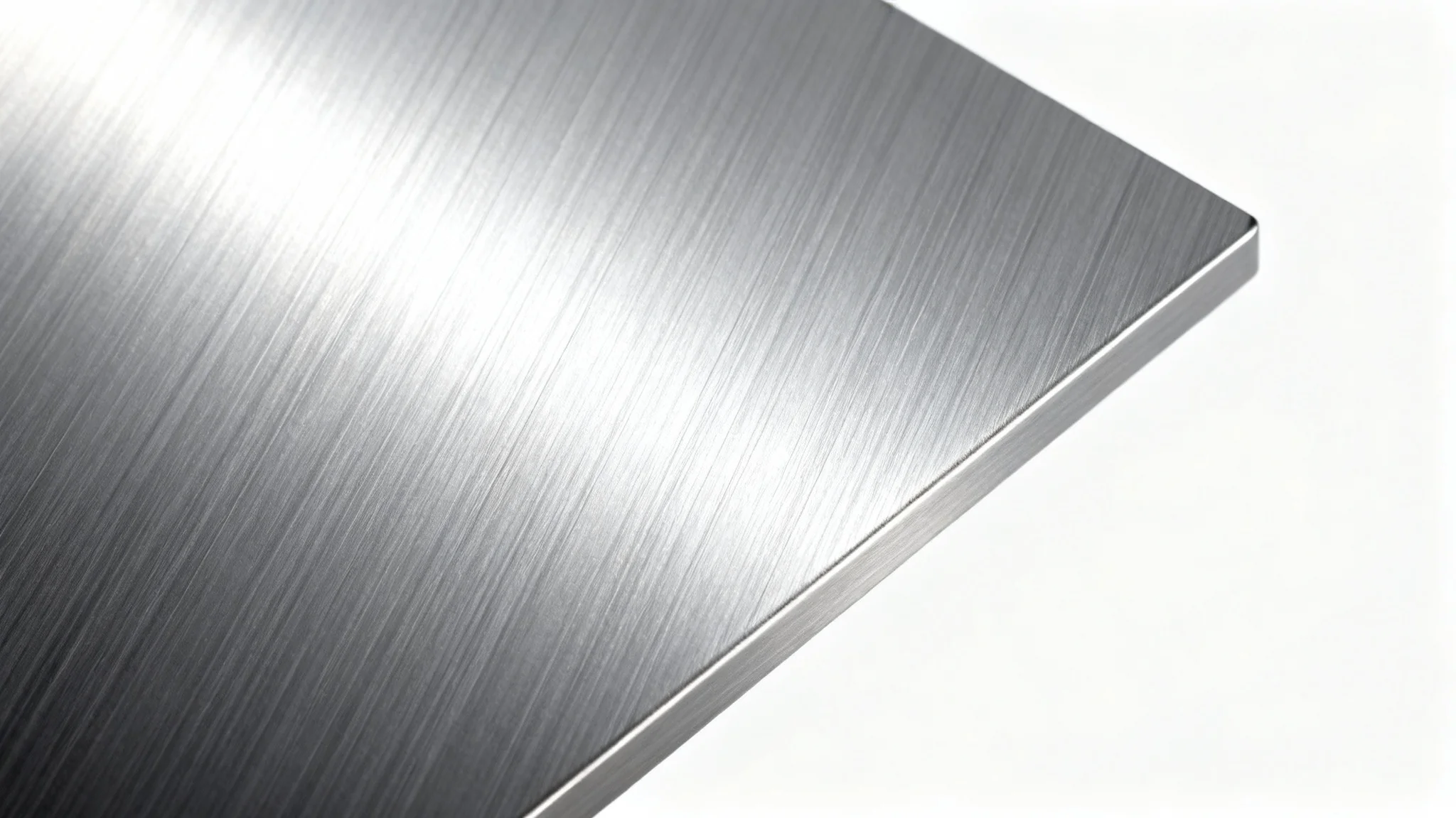 A detailed close-up shot of a brushed aluminum texture, with fine horizontal lines catching the light to create a sleek, metallic sheen against a white background.