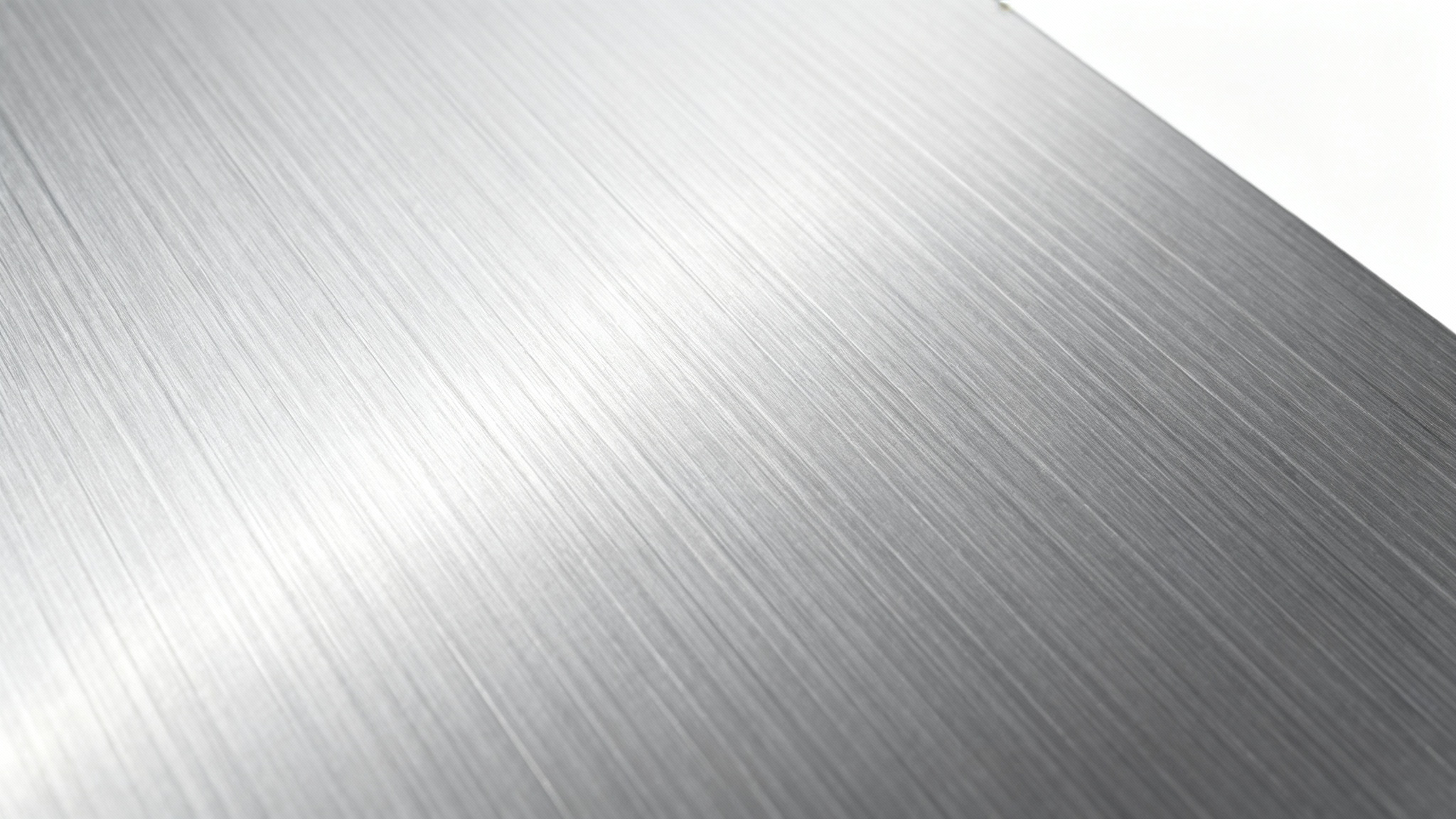 A hyper-detailed, close-up image of a brushed aluminum texture, showcasing its fine horizontal lines and metallic sheen, presented on a clean white background.