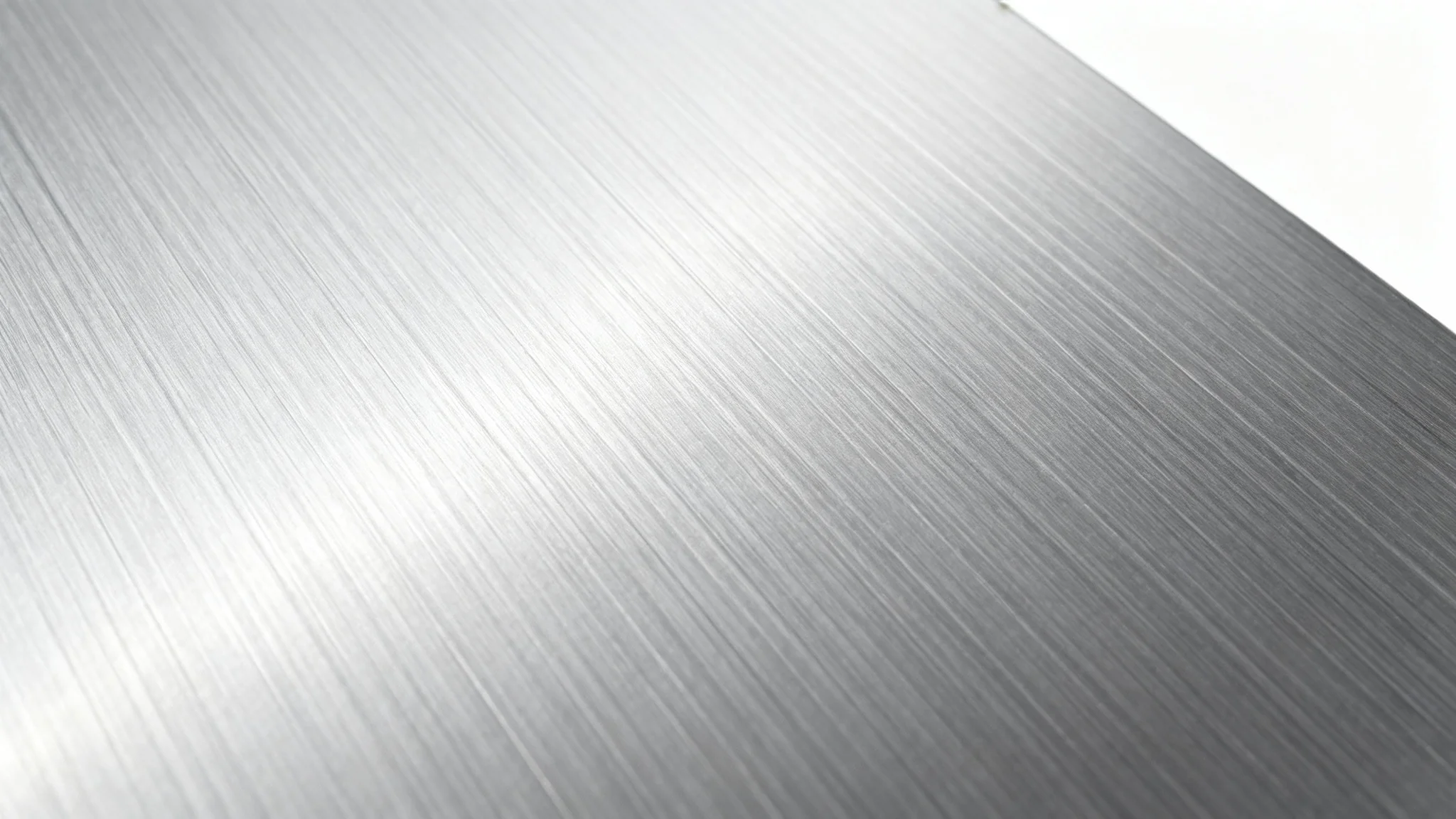 A hyper-detailed, close-up image of a brushed aluminum texture, showcasing its fine horizontal lines and metallic sheen, presented on a clean white background.