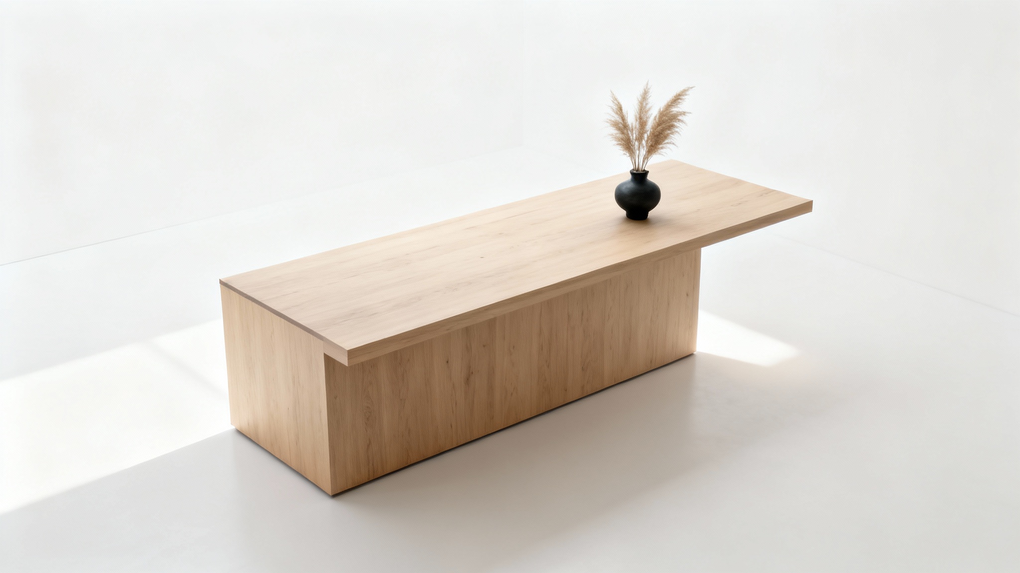 A minimalist reception desk made of light-colored wood, viewed from a high angle against a stark white background, emphasizing its clean lines and simple design.