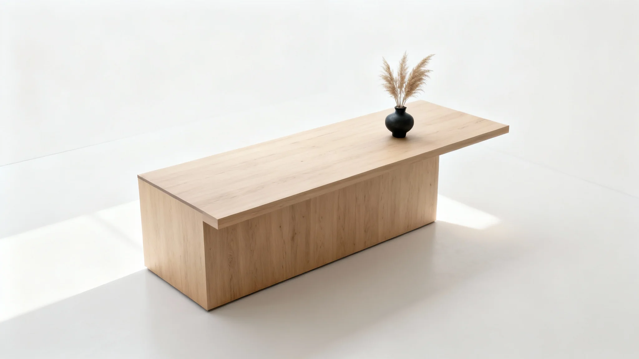 A minimalist reception desk made of light-colored wood, viewed from a high angle against a stark white background, emphasizing its clean lines and simple design.