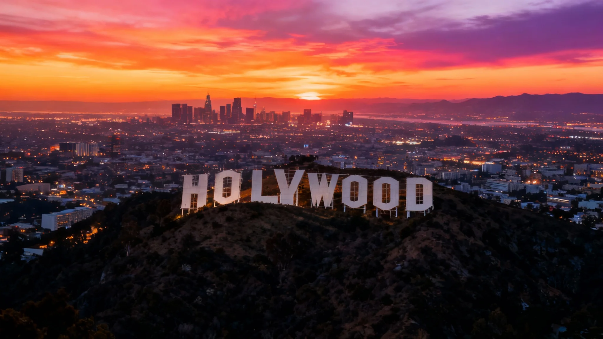 A before-and-after concept showing the result of a cutout tool, where the Hollywood sign has been removed from a plain background and placed onto a beautiful photo of the Los Angeles skyline at sunset.