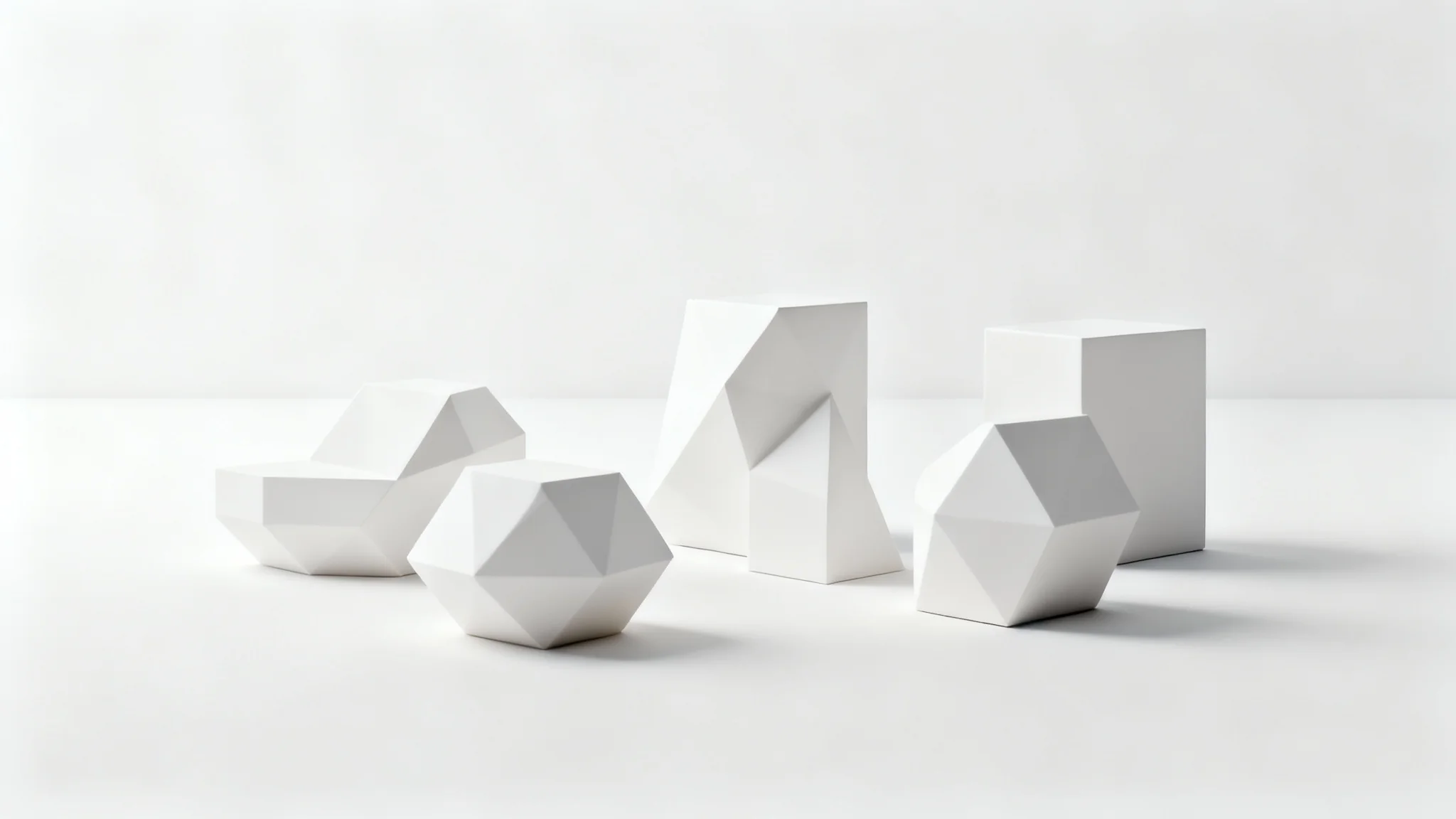 A photorealistic 3D render of several white geometric shapes on a white surface, demonstrating ambient occlusion shading with soft, realistic contact shadows in the crevices.