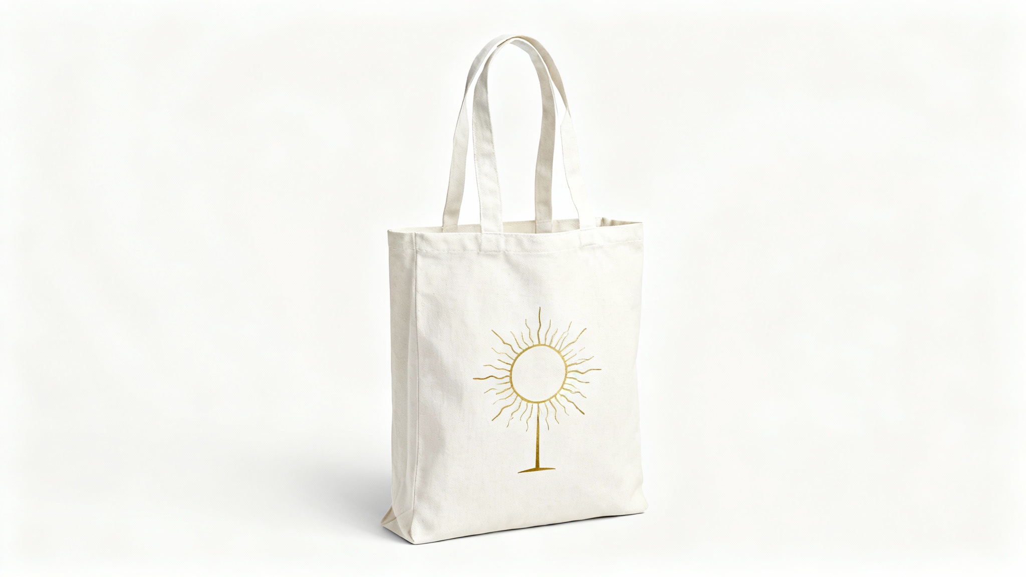 A professional mockup of an off-white canvas tote bag featuring a minimalist golden sun design, shot in a studio setting against a pure white background.