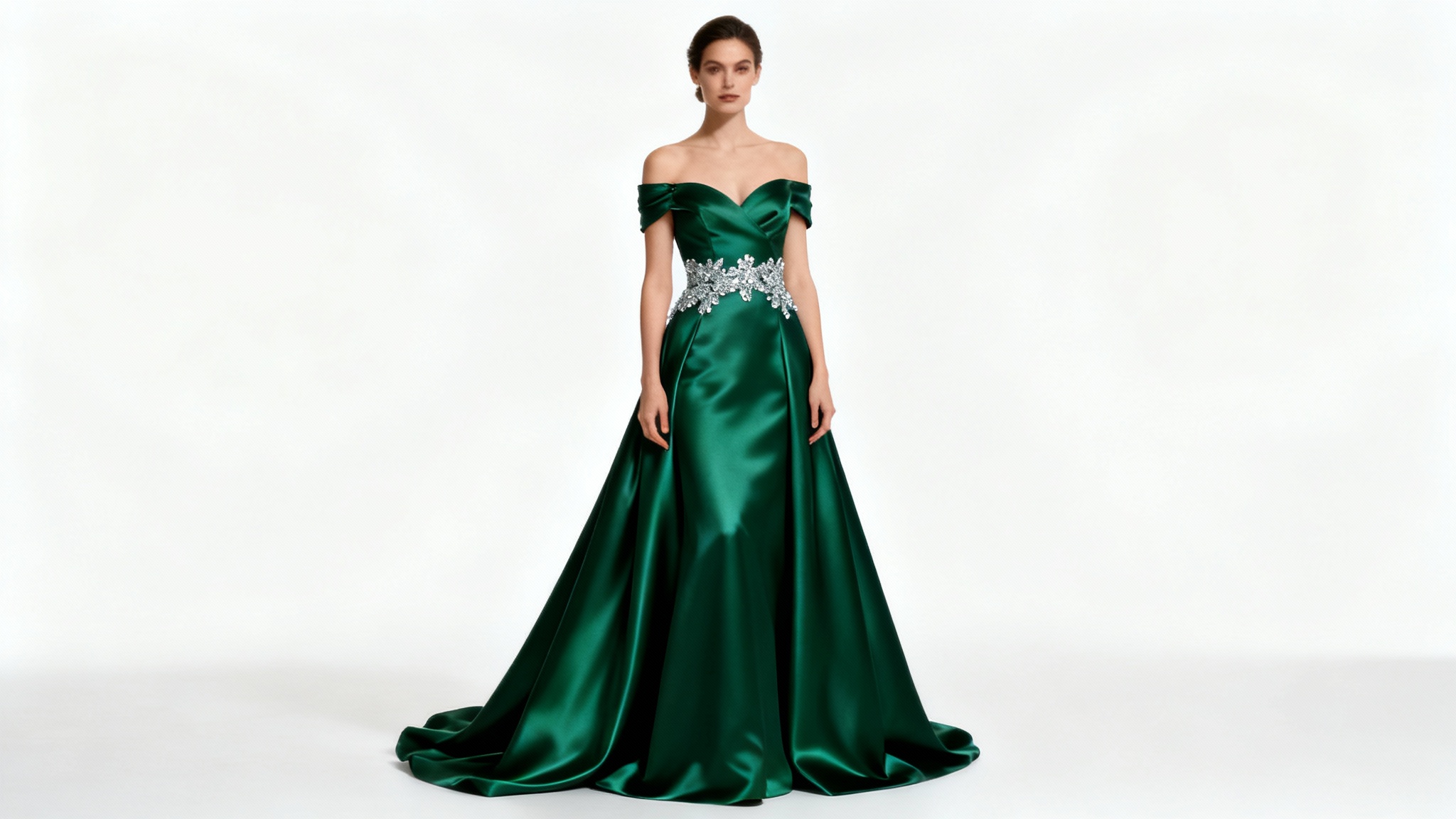 A full-body photograph of a woman modeling an elegant, floor-length emerald green formal dress against a stark white background, showcasing a perfect, professionally edited look.