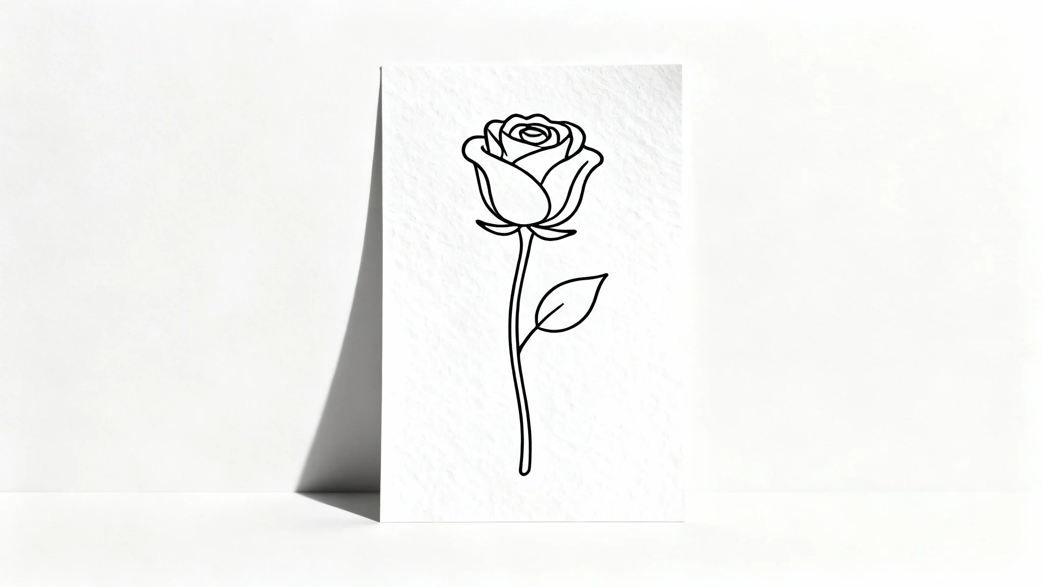 A minimalist continuous line drawing of a rose, created with a single, unbroken black line on a clean white background, showcasing an elegant and modern art style.