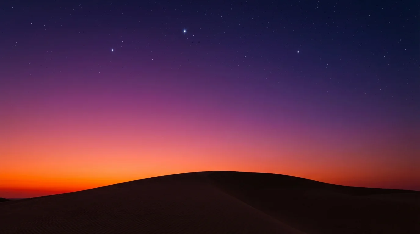 A photorealistic digital background of a desert sky at sunset, with a vibrant gradient from orange to deep blue, over the silhouette of a large sand dune.