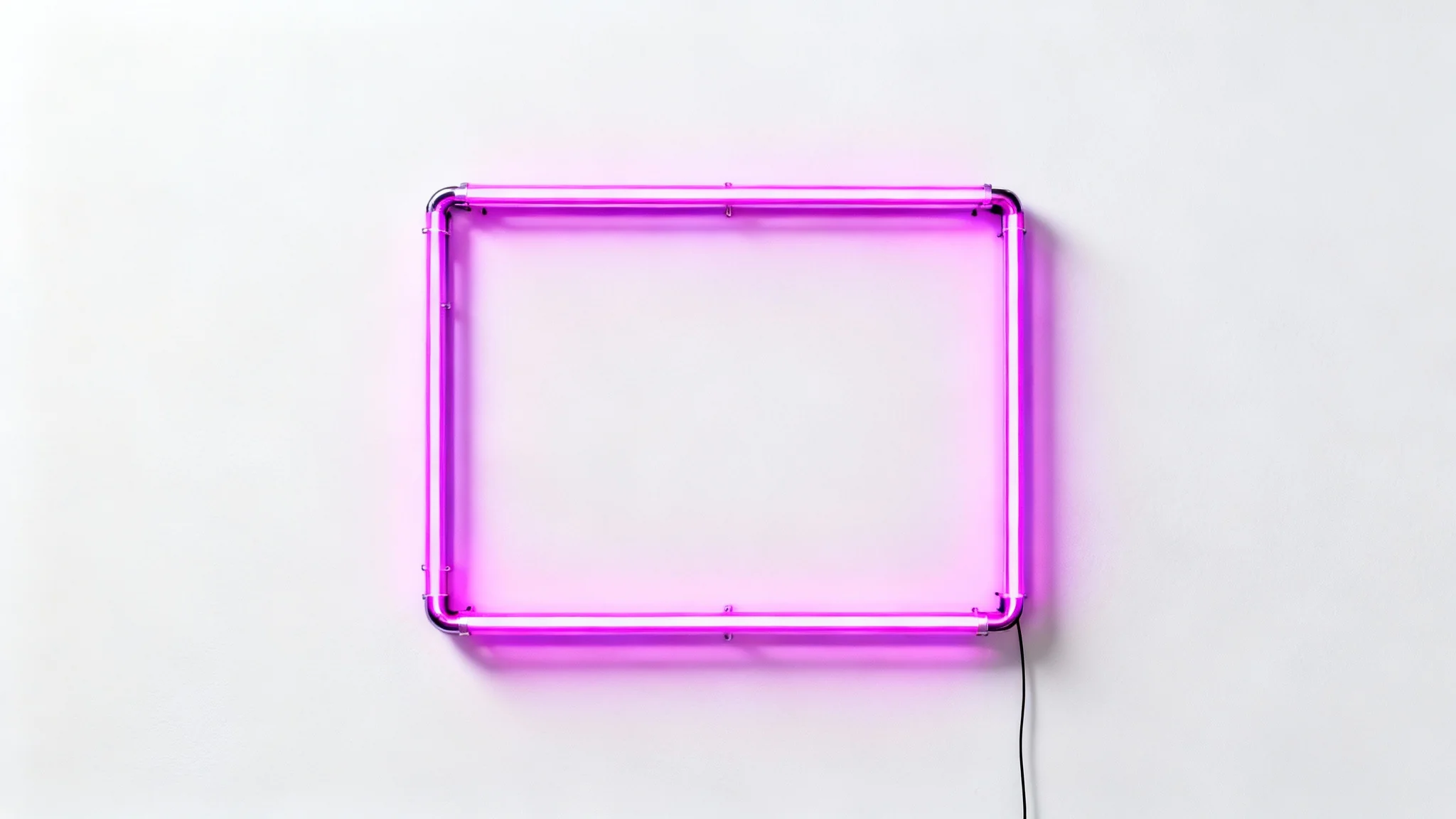 A rectangular neon frame glowing with a vibrant pink light, mounted on a plain white wall, creating a modern and eye-catching product display.