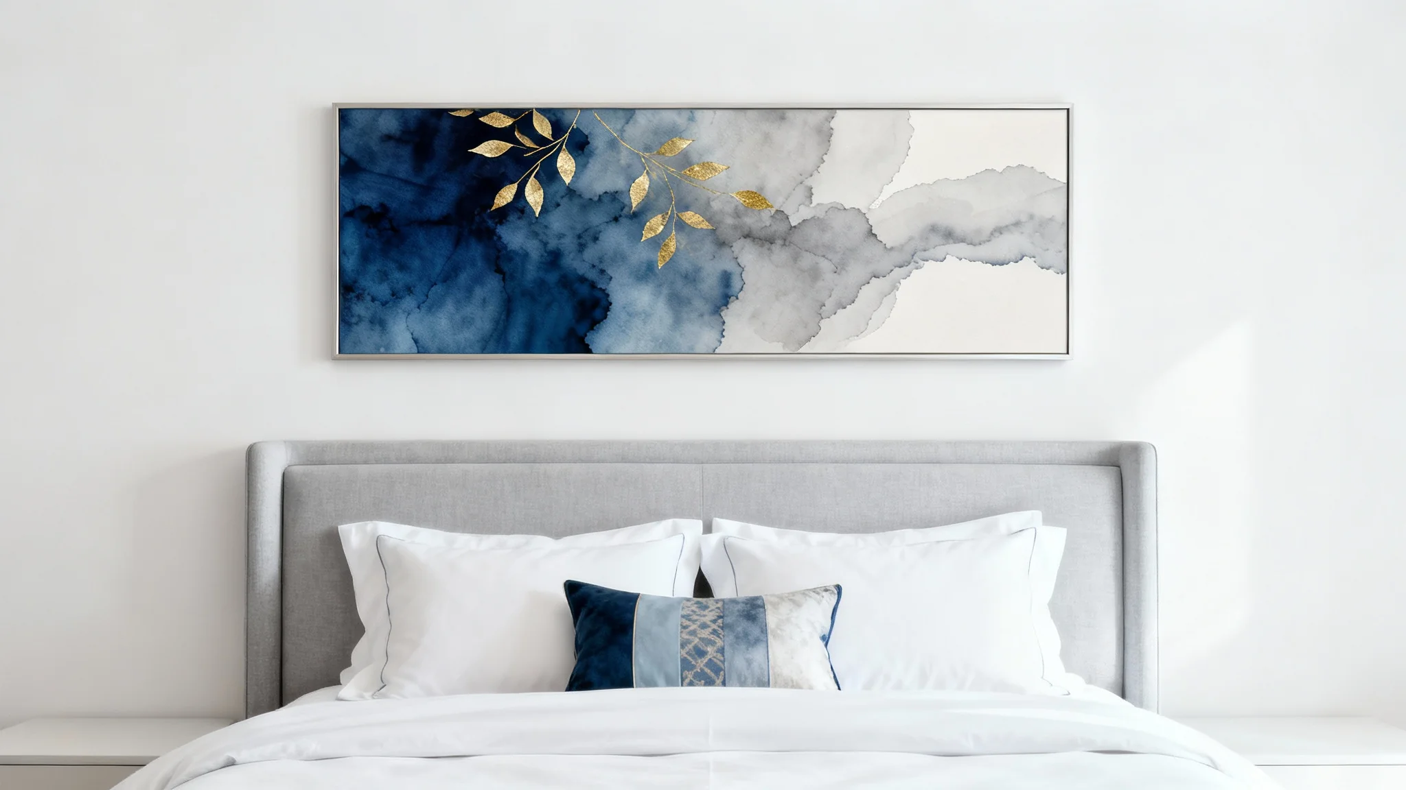 A modern, minimalist bedroom featuring a large piece of abstract blue and gold wall art hanging above a neatly made bed with a gray headboard.