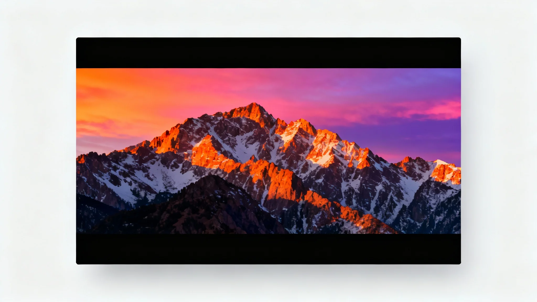 A photorealistic image of a mountain range at sunset, featuring prominent black bars at the top and bottom to demonstrate a cinematic widescreen effect.