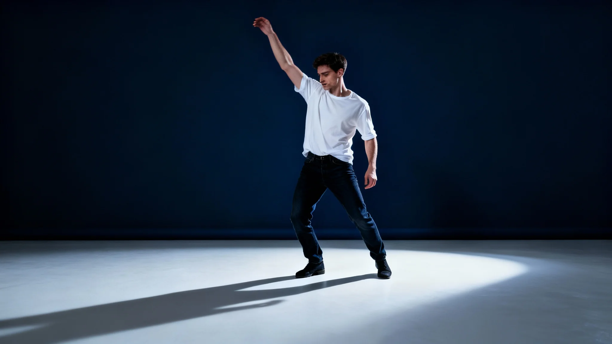 A man in a white shirt and jeans strikes a dynamic pose against a navy blue background, casting a long, realistic shadow, demonstrating the final result from a shadow generator tool.