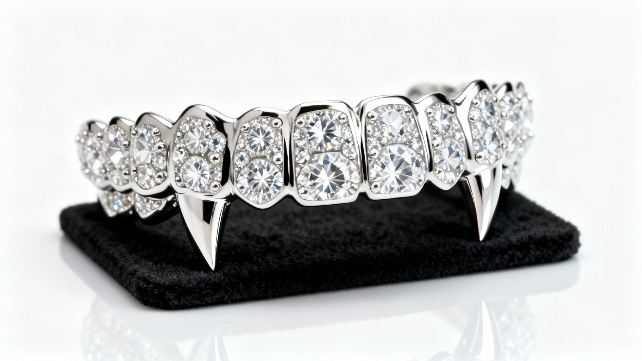A close-up shot of a luxurious, custom-made platinum and diamond grillz set with sharp fangs, displayed professionally on a stand against a clean white background.