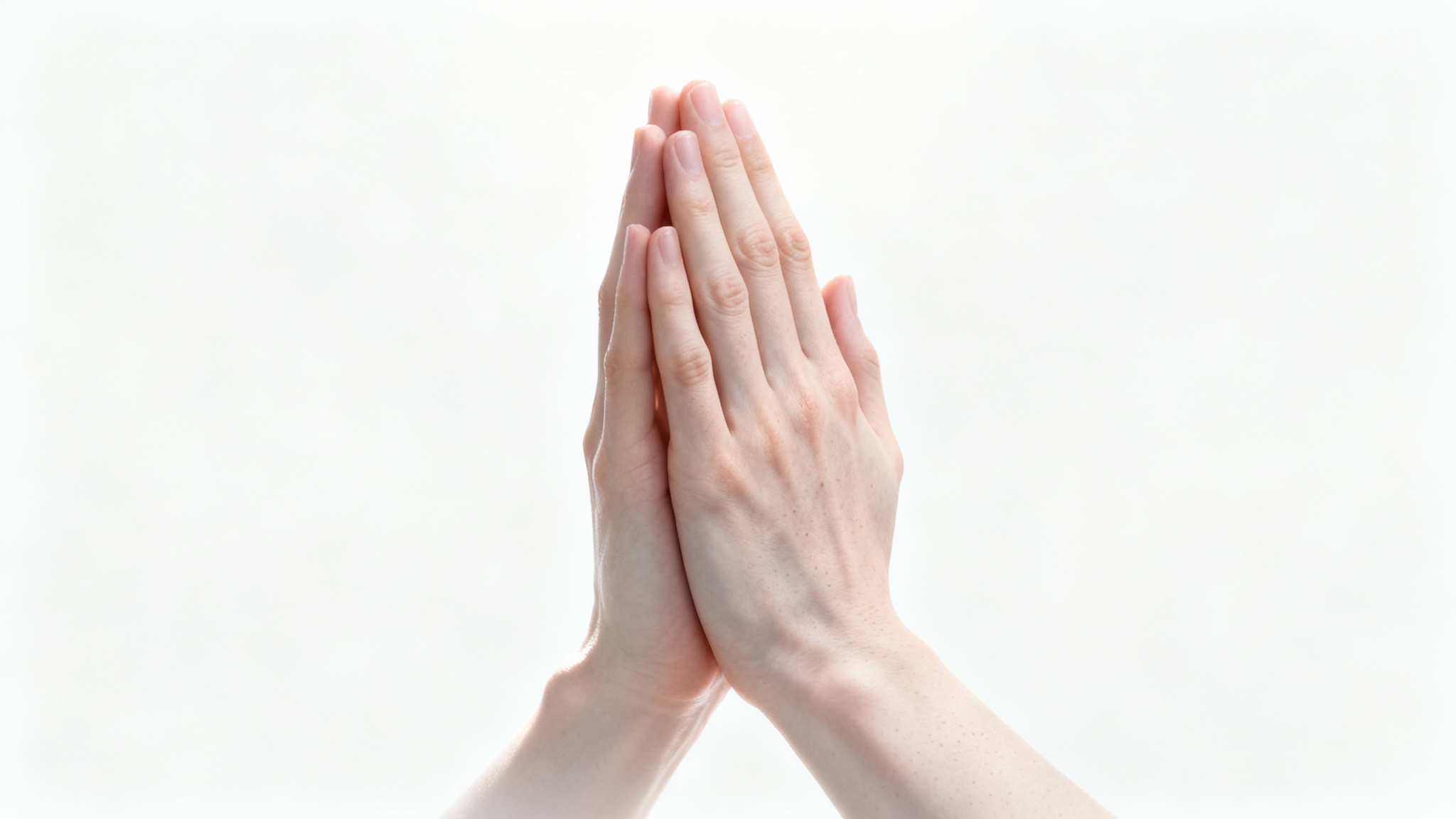 A hyper-realistic close-up photograph of a pair of hands clasped together in prayer, isolated against a pure white background, conveying a sense of peace.