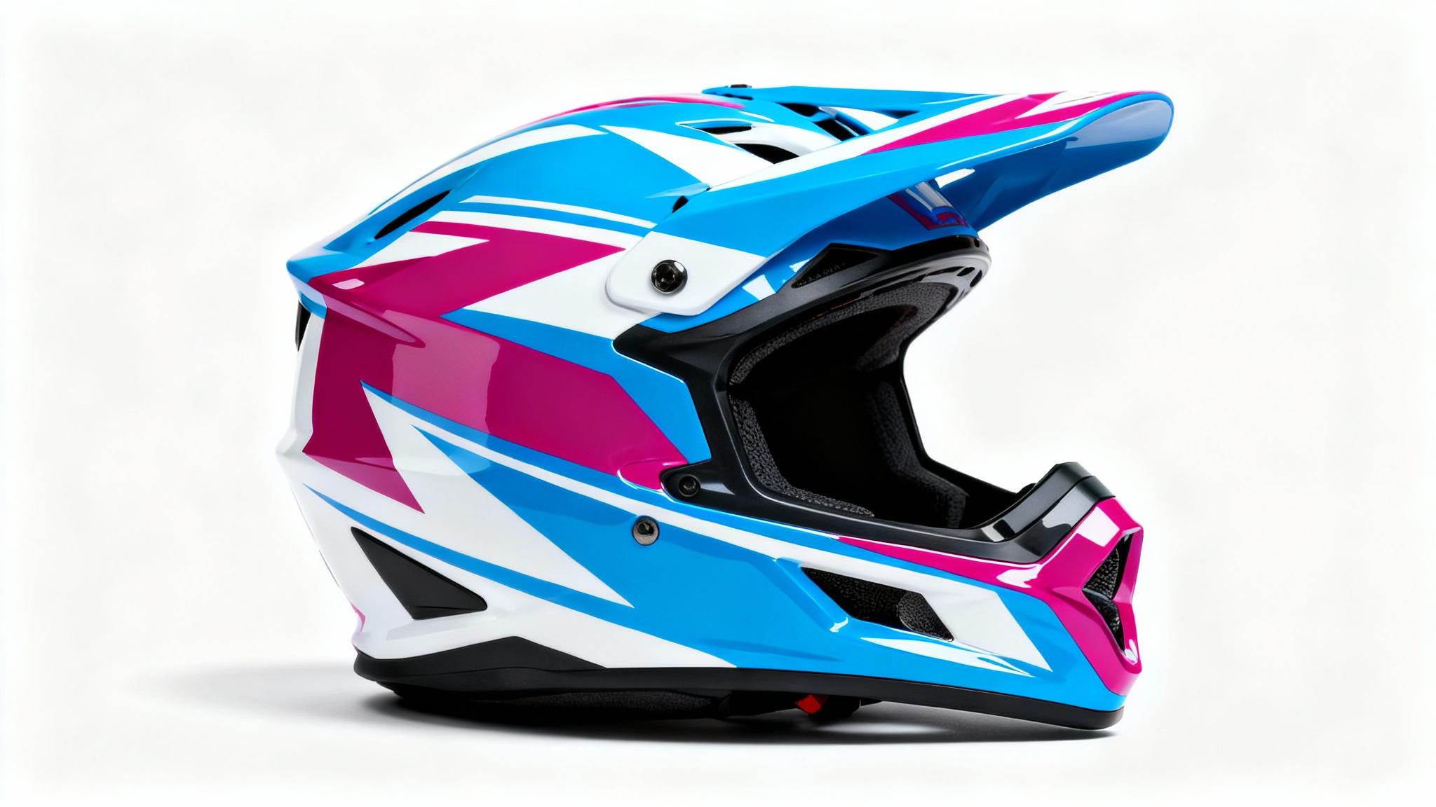 A modern motocross helmet with a custom graphic design in electric blue, magenta, and white on a matte black finish, shot in a professional studio with a white background.