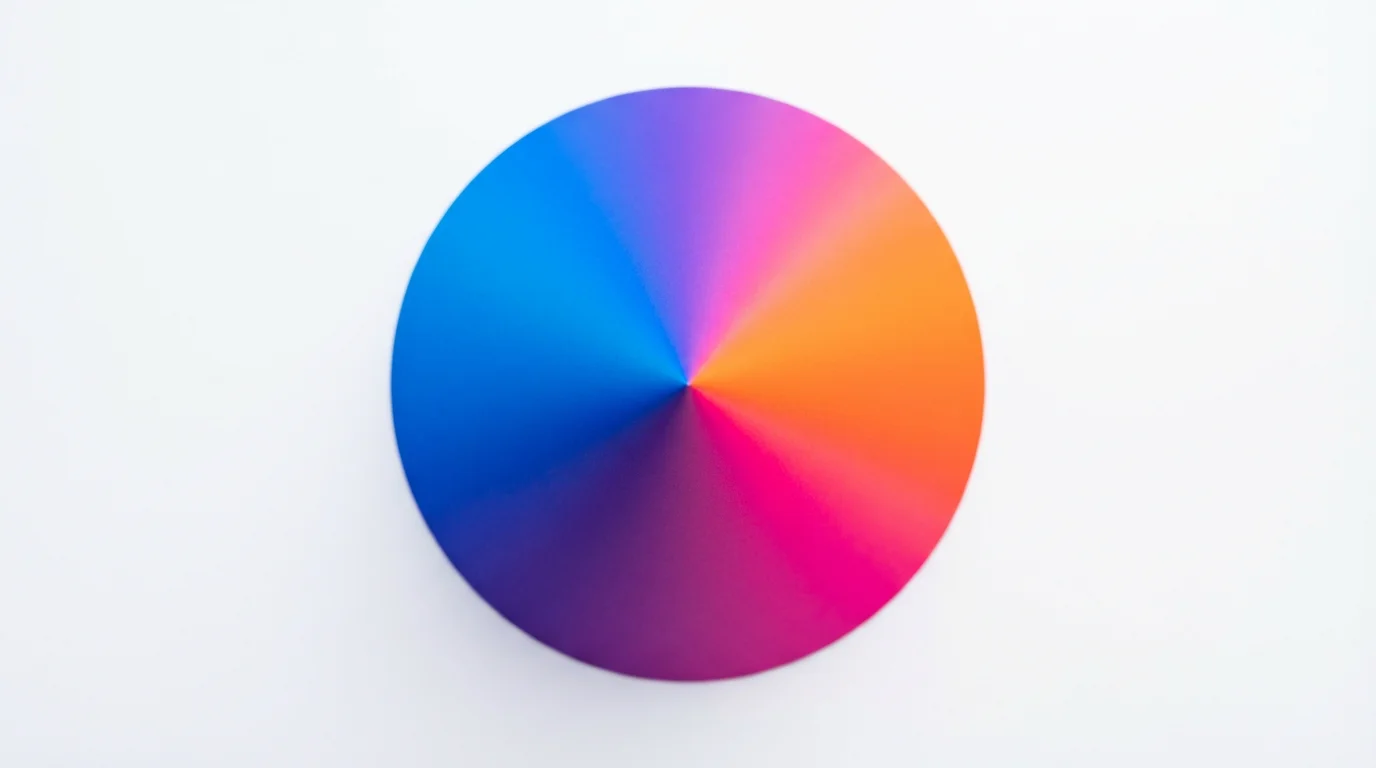 An abstract, top-down view of a cone shape displaying a vibrant conic gradient that transitions smoothly through blue, purple, pink, and orange against a plain white background.