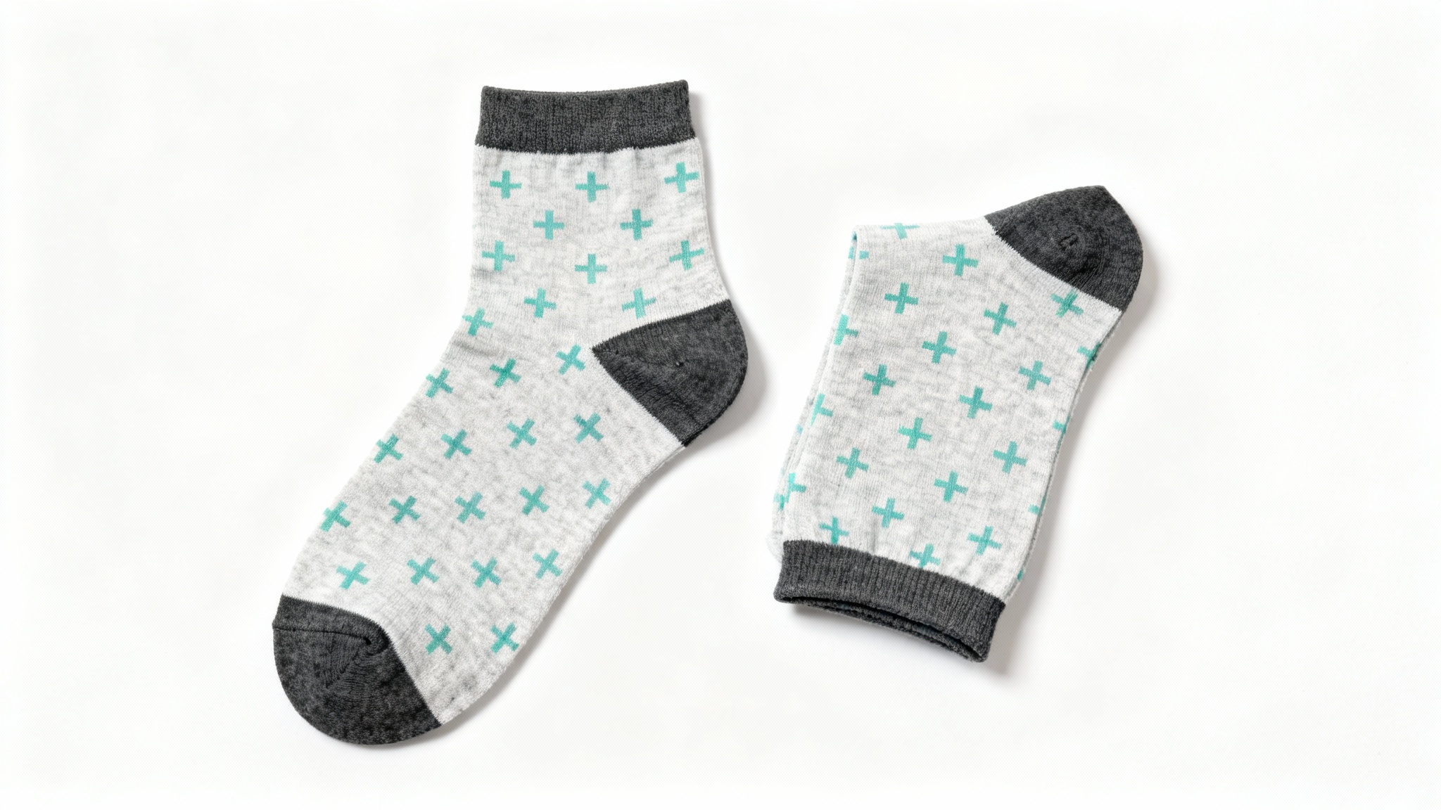 A product mockup photo of a pair of light grey ankle socks with a mint green pattern, shown against a plain white background.