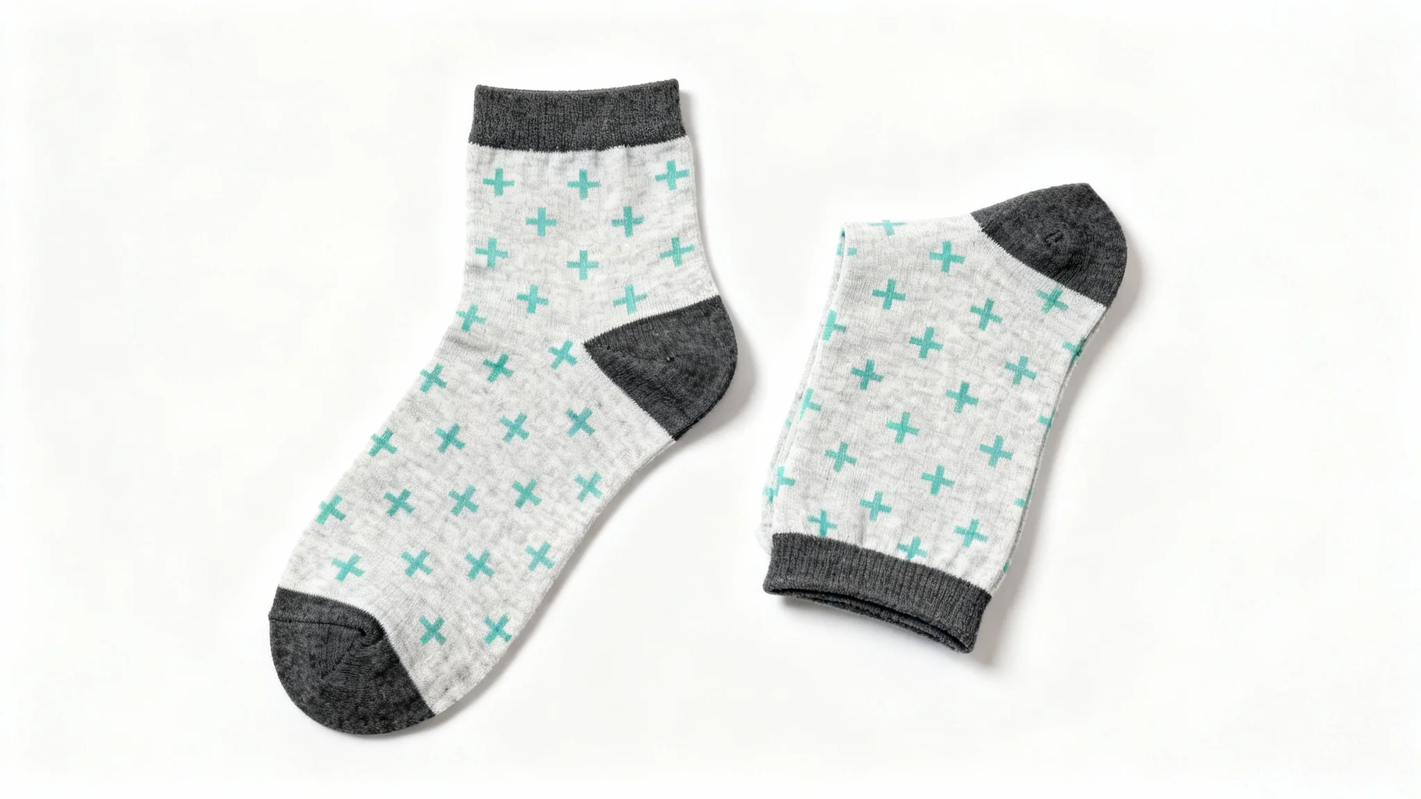A product mockup photo of a pair of light grey ankle socks with a mint green pattern, shown against a plain white background.