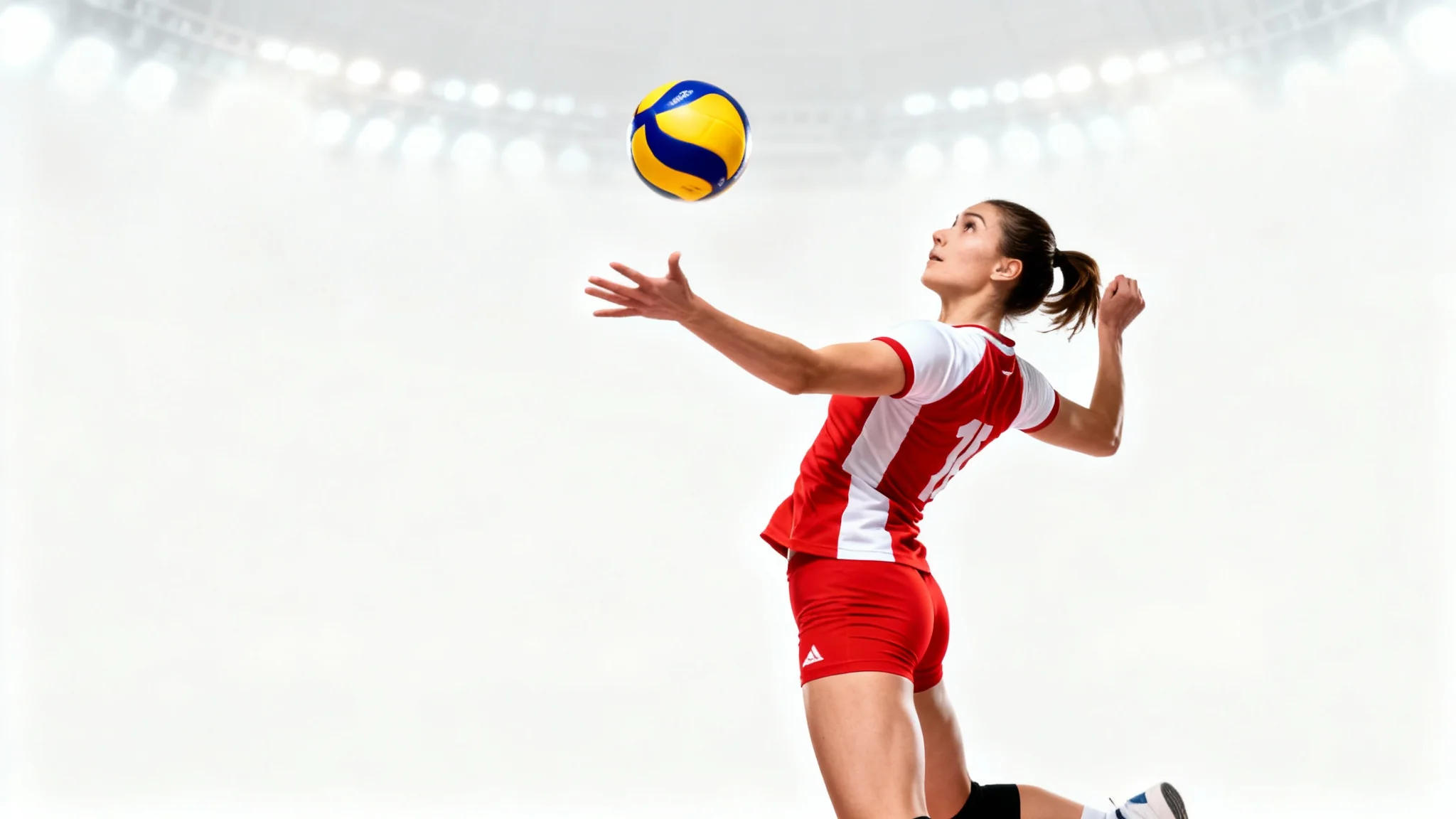 A dynamic photo of a female volleyball player in a red and white jersey, frozen mid-air as she is about to spike a volleyball, on a clean white background.