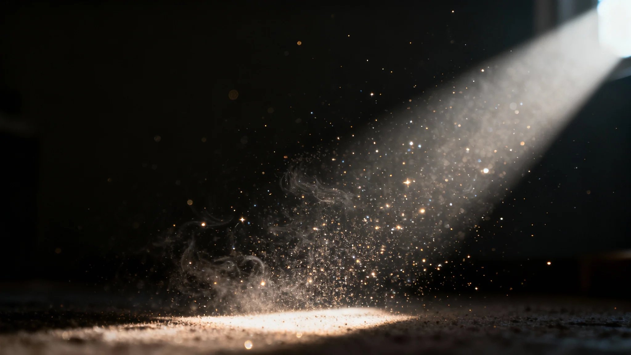 A photorealistic image of a dark room with a single, bright beam of sunlight shining through, illuminating thousands of tiny, swirling dust particles in the air, creating a textured and atmospheric effect.