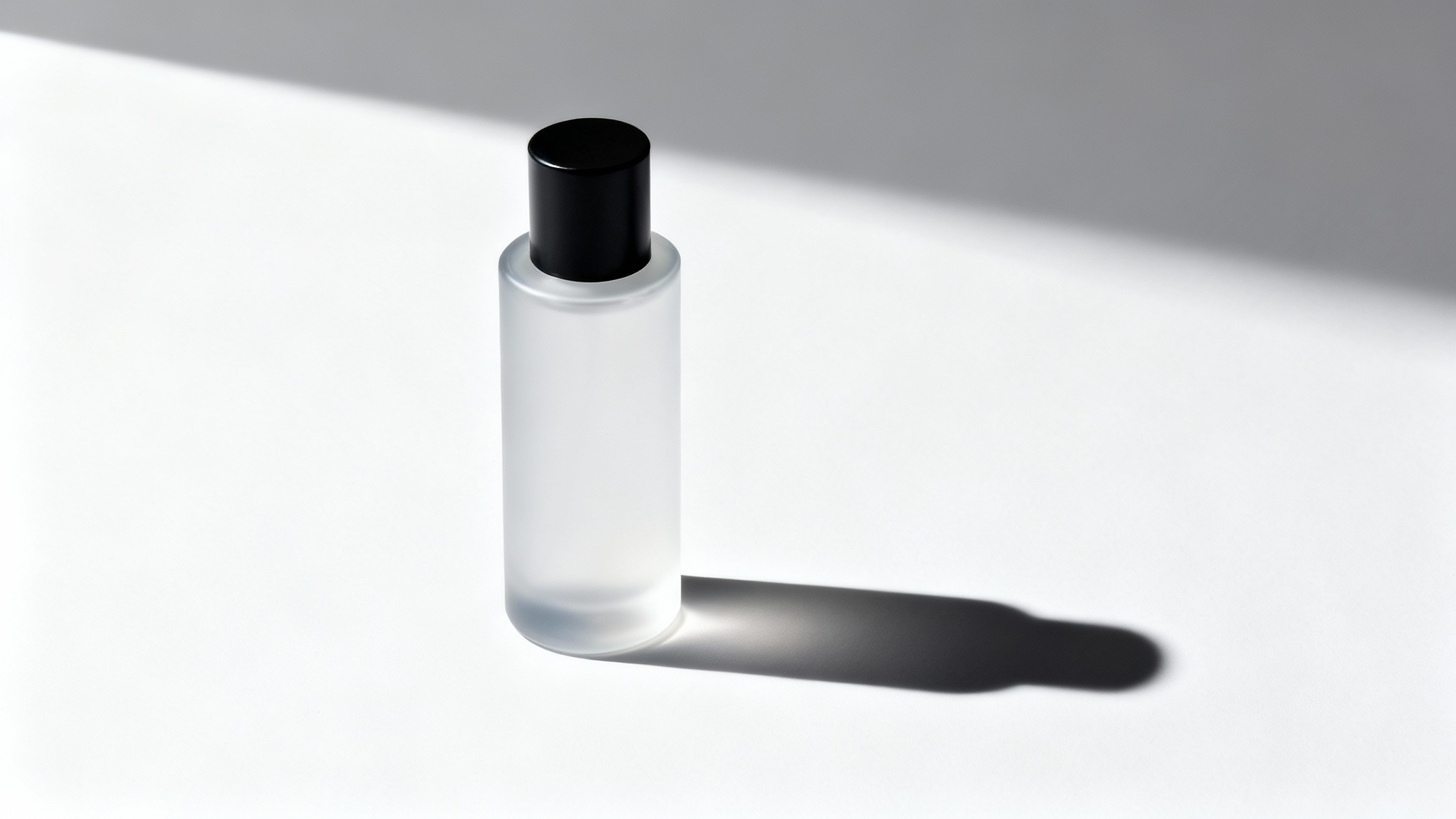 A photorealistic mockup of a sleek cosmetic bottle on a white background, casting a sharp and realistic shadow to its side, demonstrating a product shadow effect.