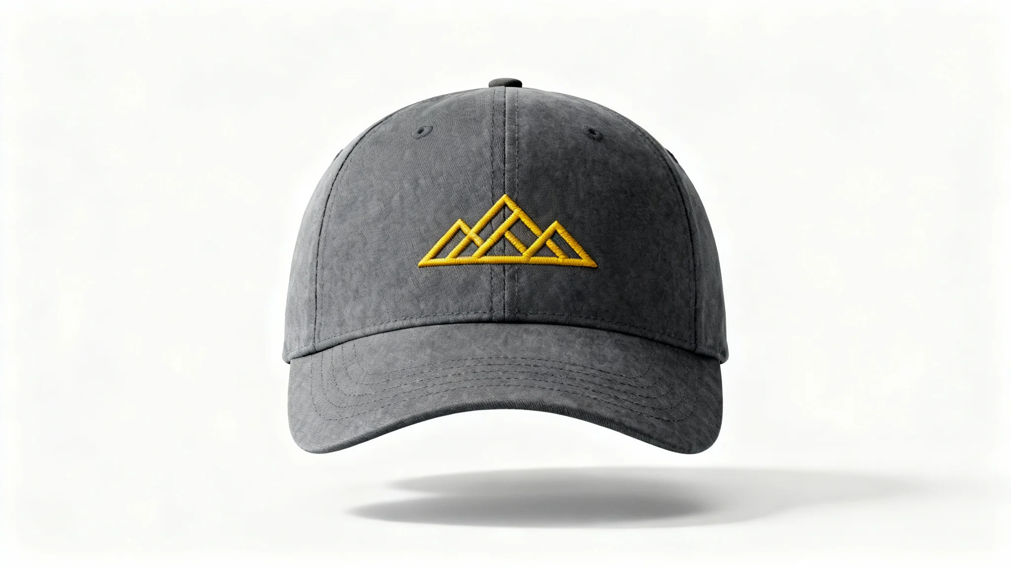 A photorealistic mockup of a charcoal gray dad hat featuring a minimalist golden-yellow embroidered mountain range logo, presented on a clean white background.