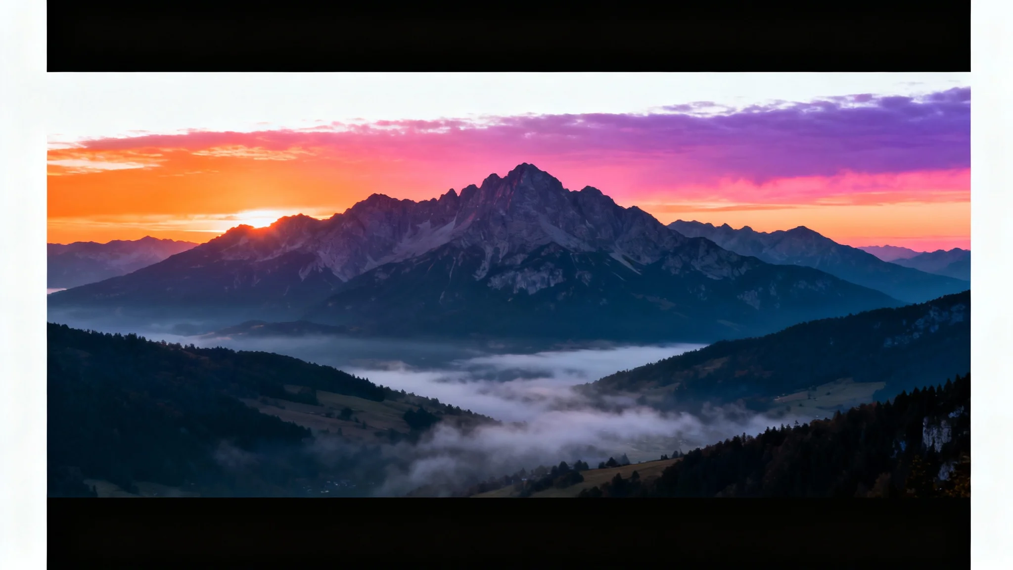 A photorealistic image of a mountain landscape at sunrise, with black bars at the top and bottom creating a cinematic letterbox effect, on a white background.