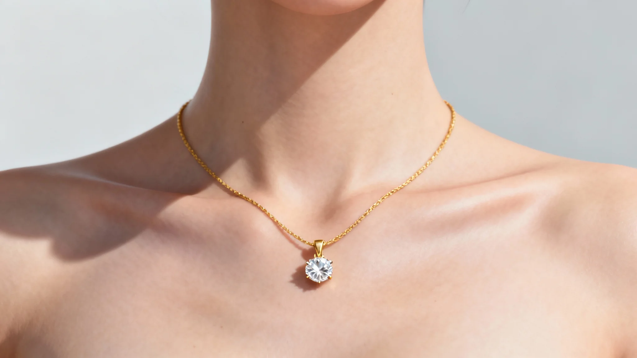 A close-up image showing a woman's neck where a beautiful and realistic digital necklace with a diamond pendant has been virtually tried on, demonstrating the final result of the tool.