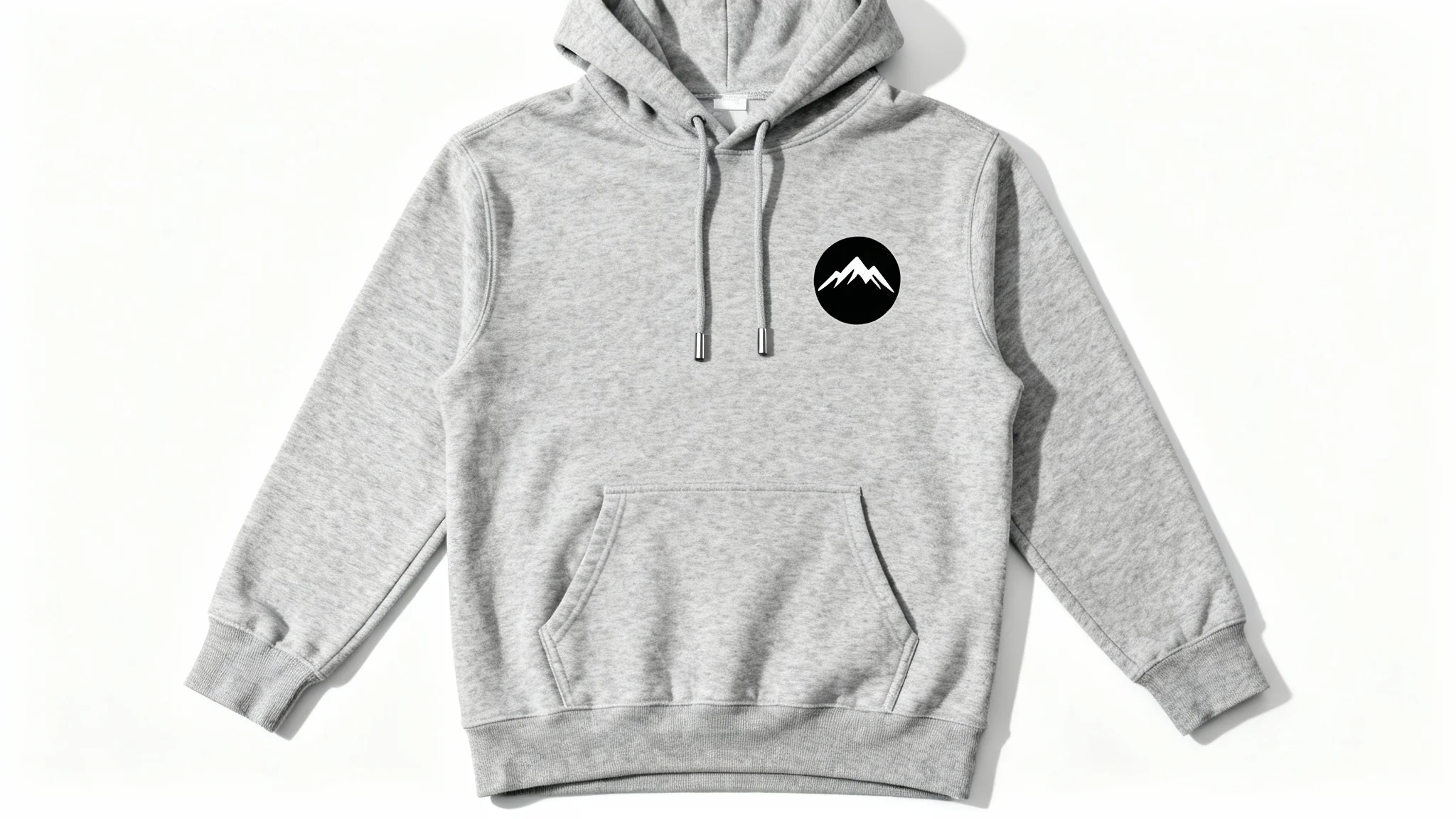 A high-quality heather grey hoodie with a black circular mountain range logo, laid flat on a clean white background in a professional product mockup style.