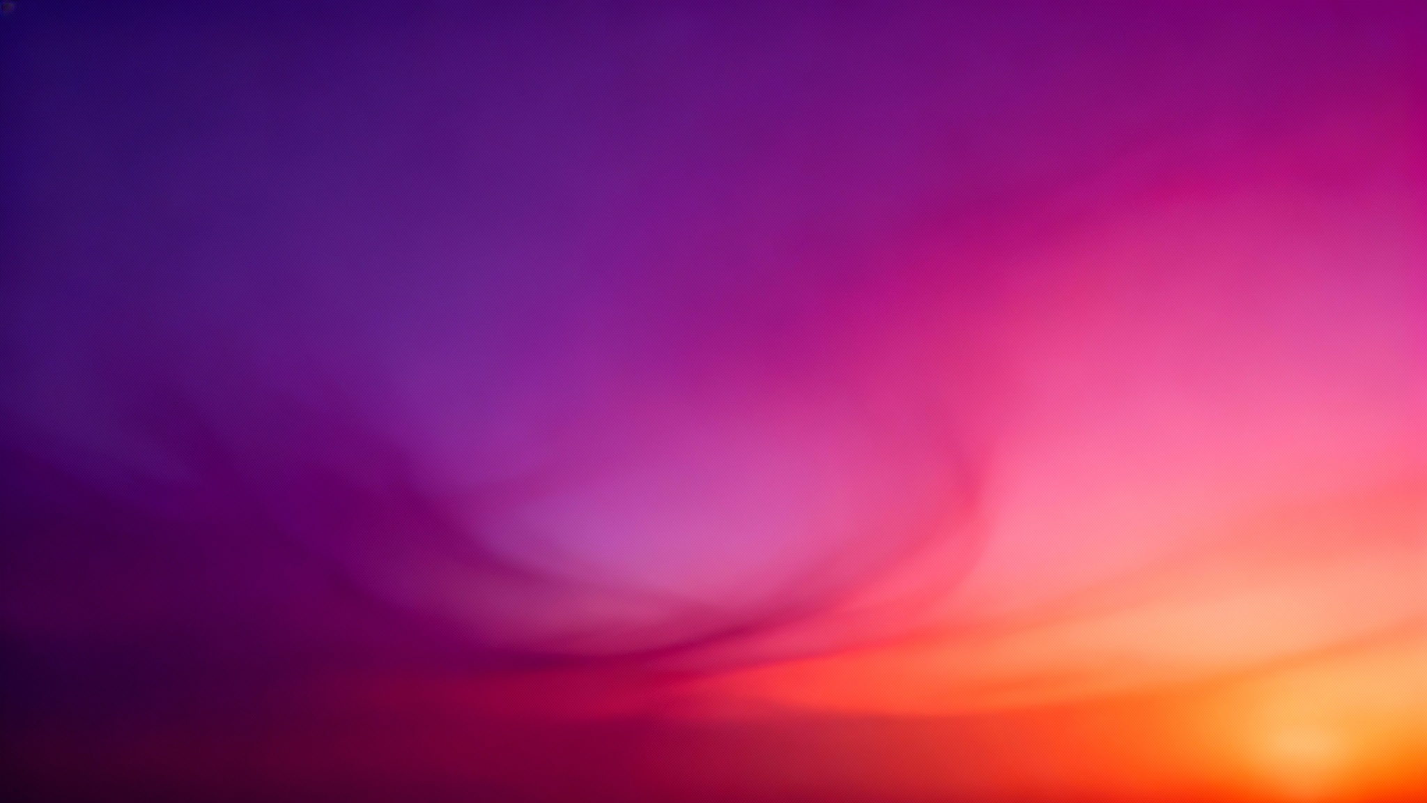 An abstract background image with a smooth, vibrant gradient flowing from deep purple to magenta and warm orange.