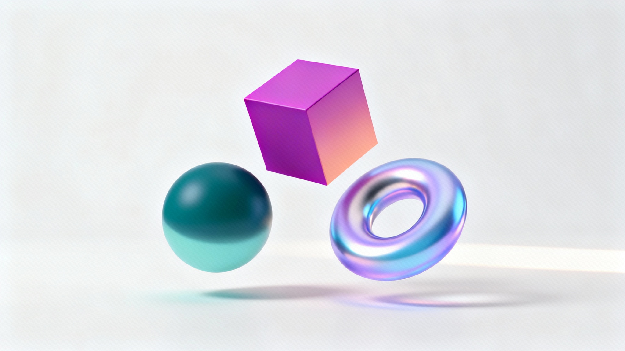 A collection of 3D geometric shapes, a sphere, cube, and torus, each displaying a unique and smooth color gradient, floating against a clean white background.