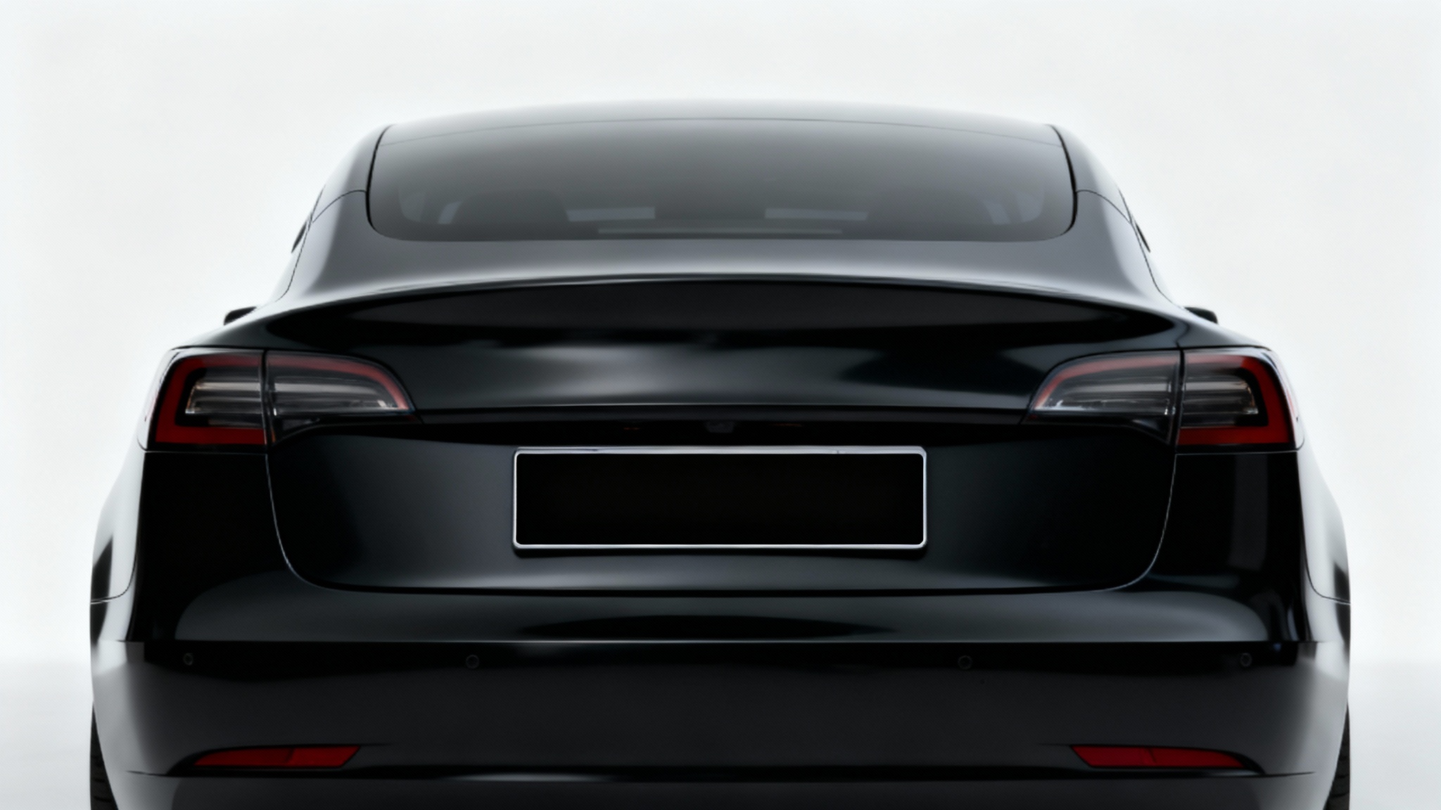 A close-up photograph of the back of a black car, where the license plate is completely obscured by a black bar, illustrating the concept of redacting sensitive information.